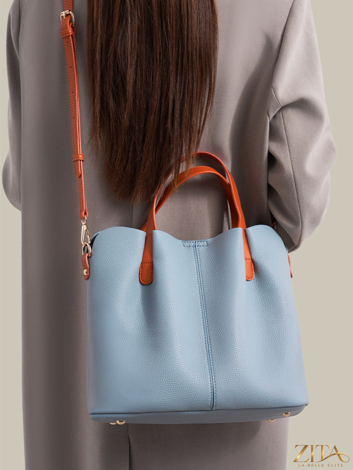 Leather contrast handle handbag by Trendsi, featuring stylish leather straps and spacious interior, shown in a close-up view.