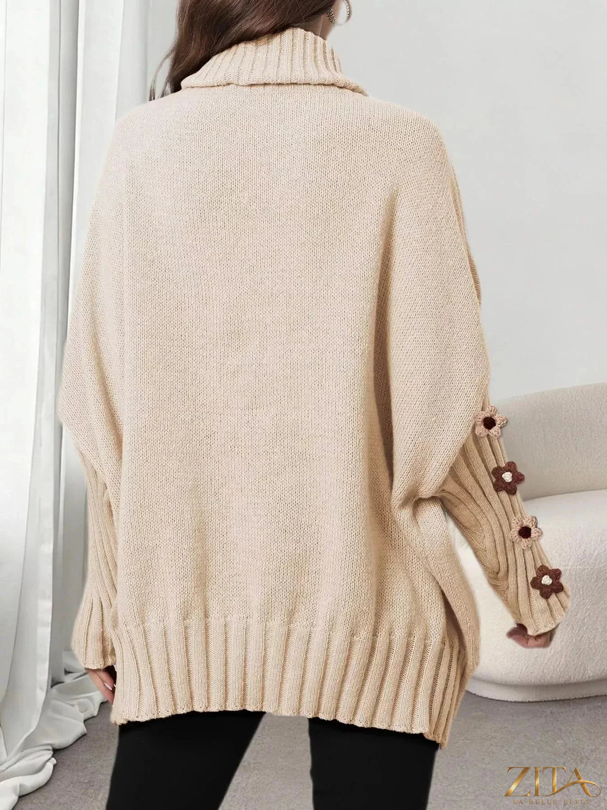 Zita La Belle Elite oversized turtleneck sweater with floral applique sleeves, cozy knit with stylish floral details.