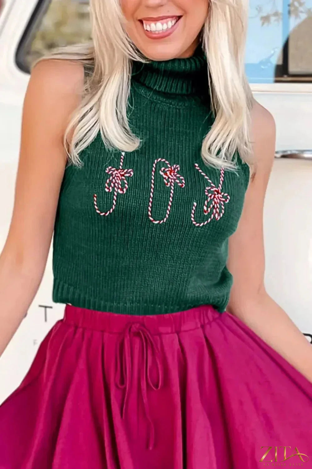 Zita La Belle Elite festive red turtleneck sweater vest with embroidered candy cane design for holiday style.