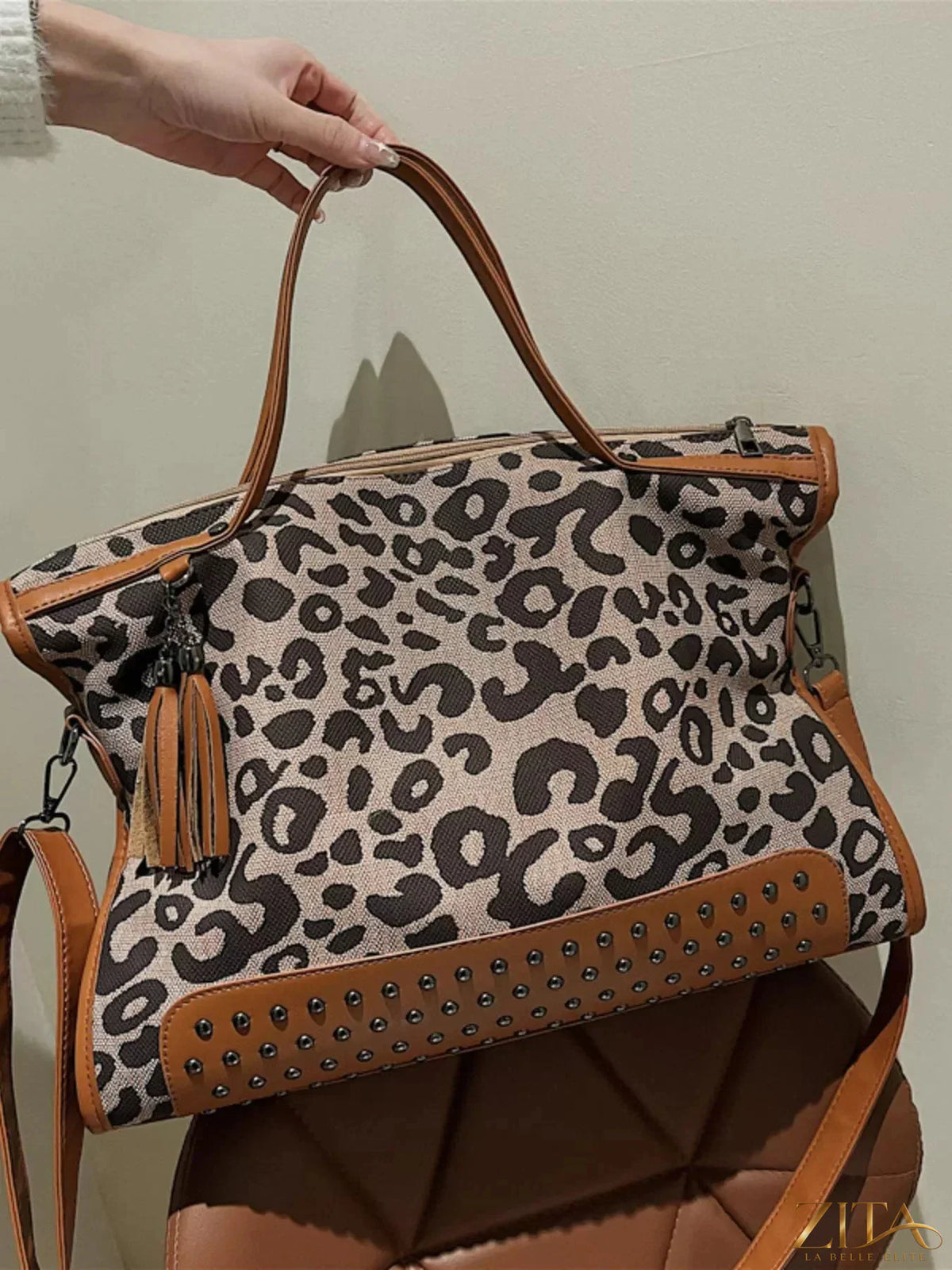 Leopard studded tote bag by Zita La Belle Elite with black leather straps and gold-tone stud accents, stylish and spacious.