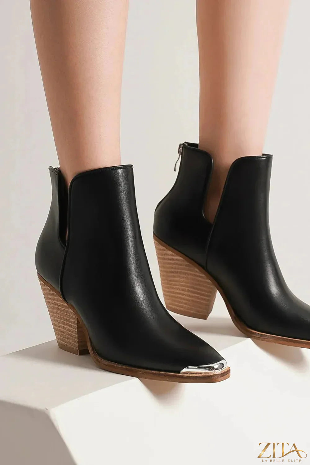 Black pointed metal-tip toe ankle boots by Zita La Belle Elite with block heels and sleek leather finish.