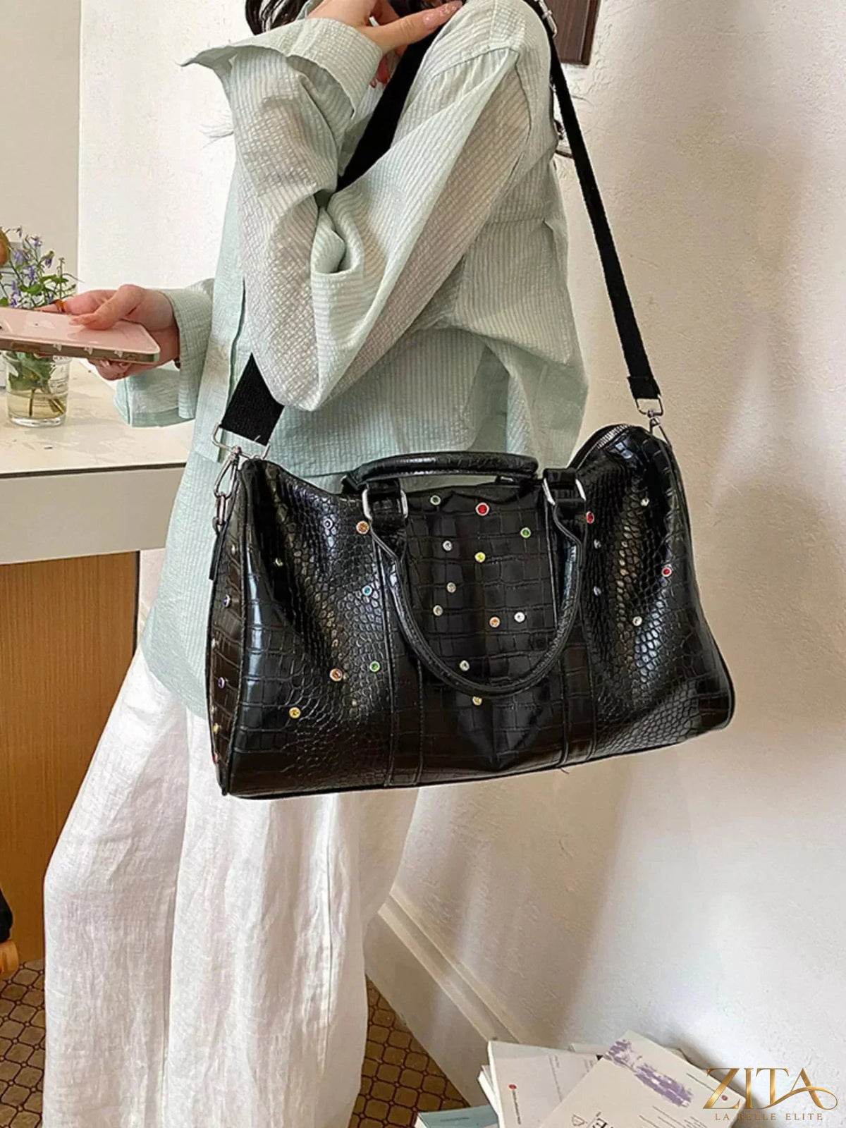 Crocodile embossed studded travel bag by Zita La Belle Elite with leather handles and multiple compartments for travel essentials.
