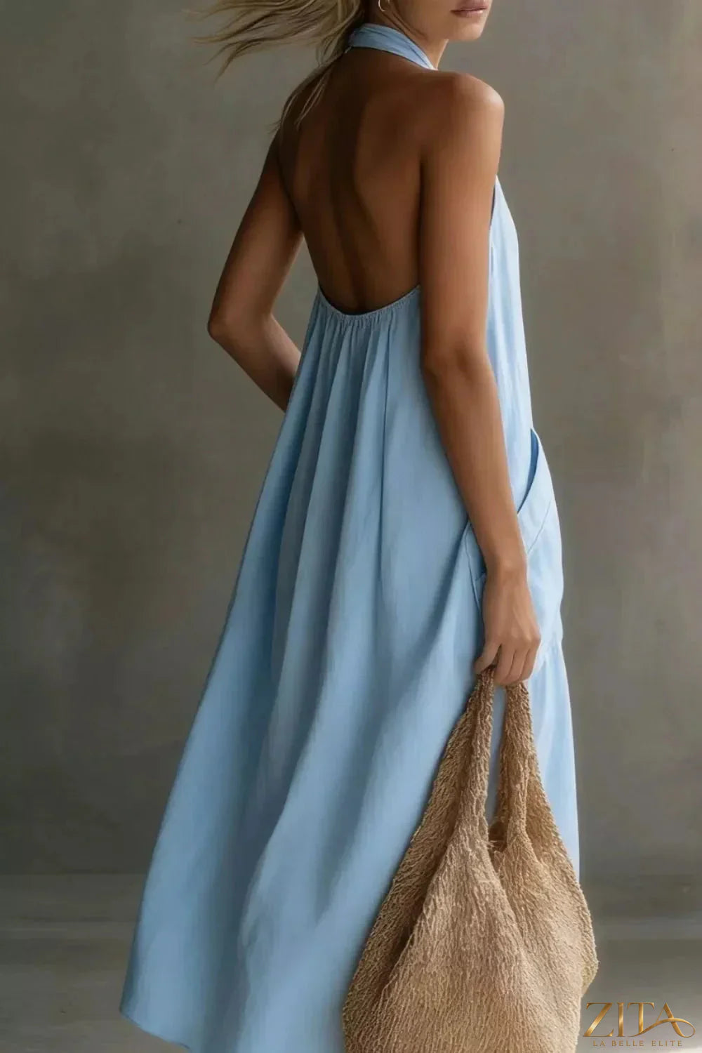 Zita La Belle Elite casual halter neck pocket midi dress shown in a stylish sleeveless design with side pockets and a flowy silhouette.