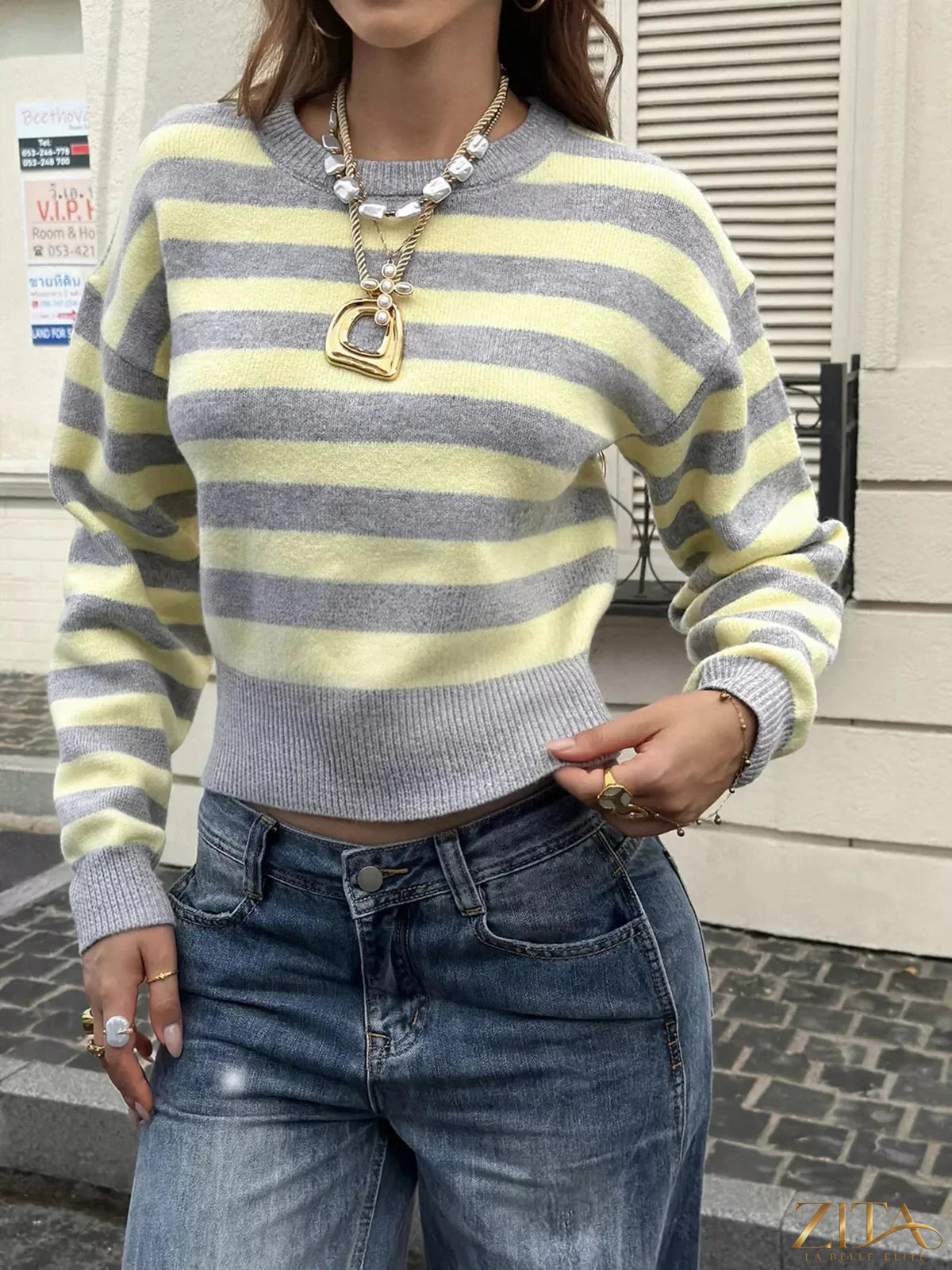 Casual striped cropped sweater by Trendsi featuring a relaxed fit, soft fabric, and stylish horizontal stripe pattern.