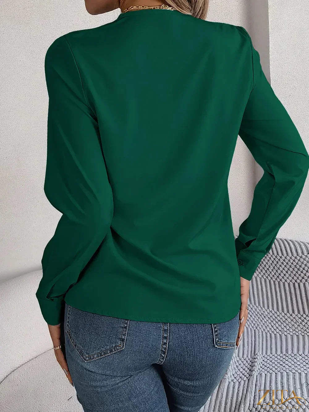 Zita La Belle Elite V-neck long sleeve blouse in soft fabric, shown in a close-up of the stylish neckline and sleeve details.