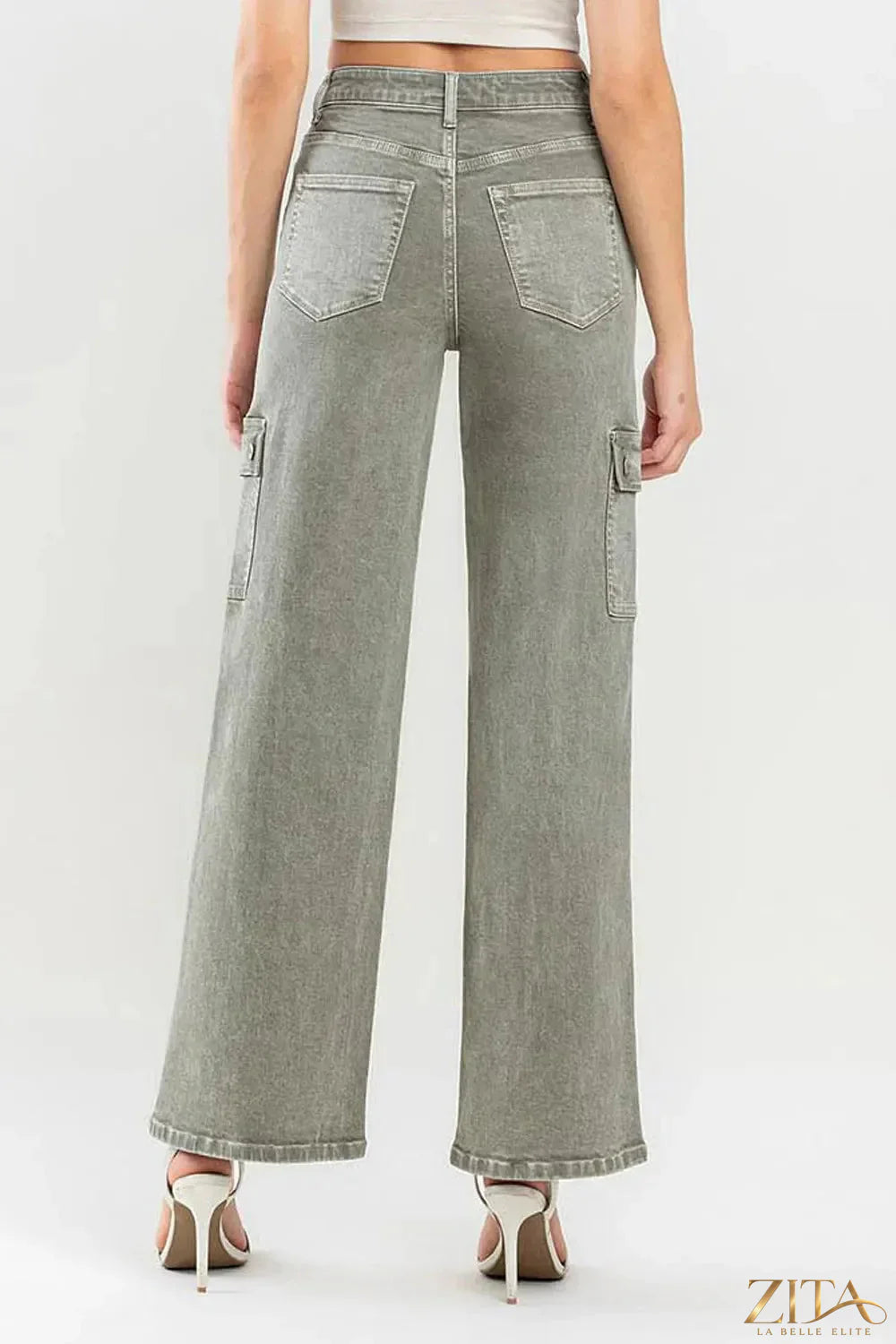 Vervet by Flying Monkey 90's super high-rise cargo jeans with multiple pockets in denim, styled on a model.
