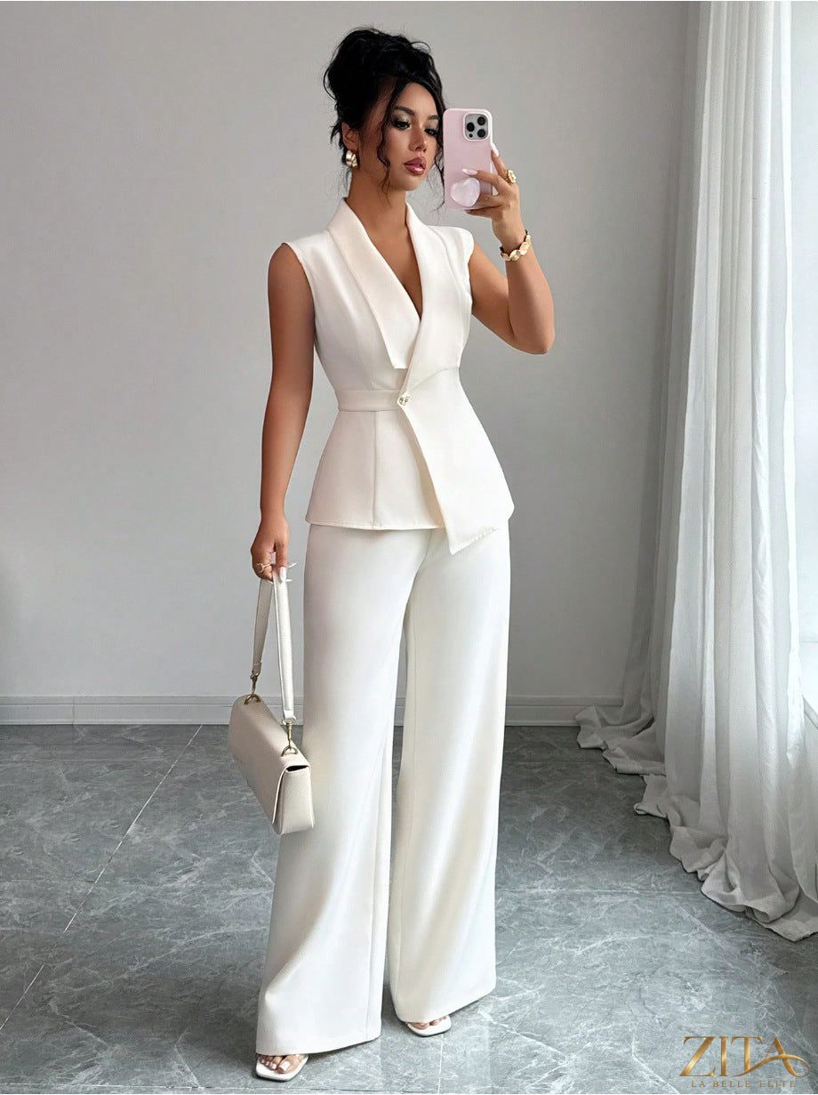 Women's peplum sleeveless blazer and wide-leg pants two-piece set by Zita La Belle Elite, featuring stylish tailored design.