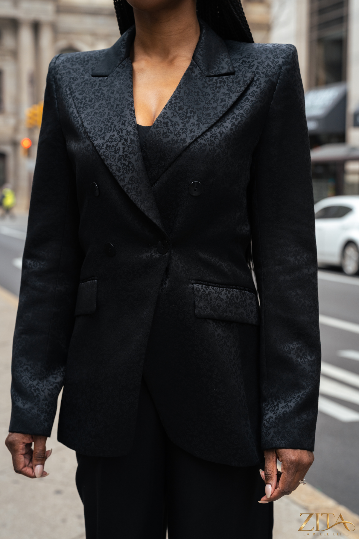Zita La Belle Elite PREMIER black blazer on a hanger, tailored fit with notch lapel and button closure, showing front view.