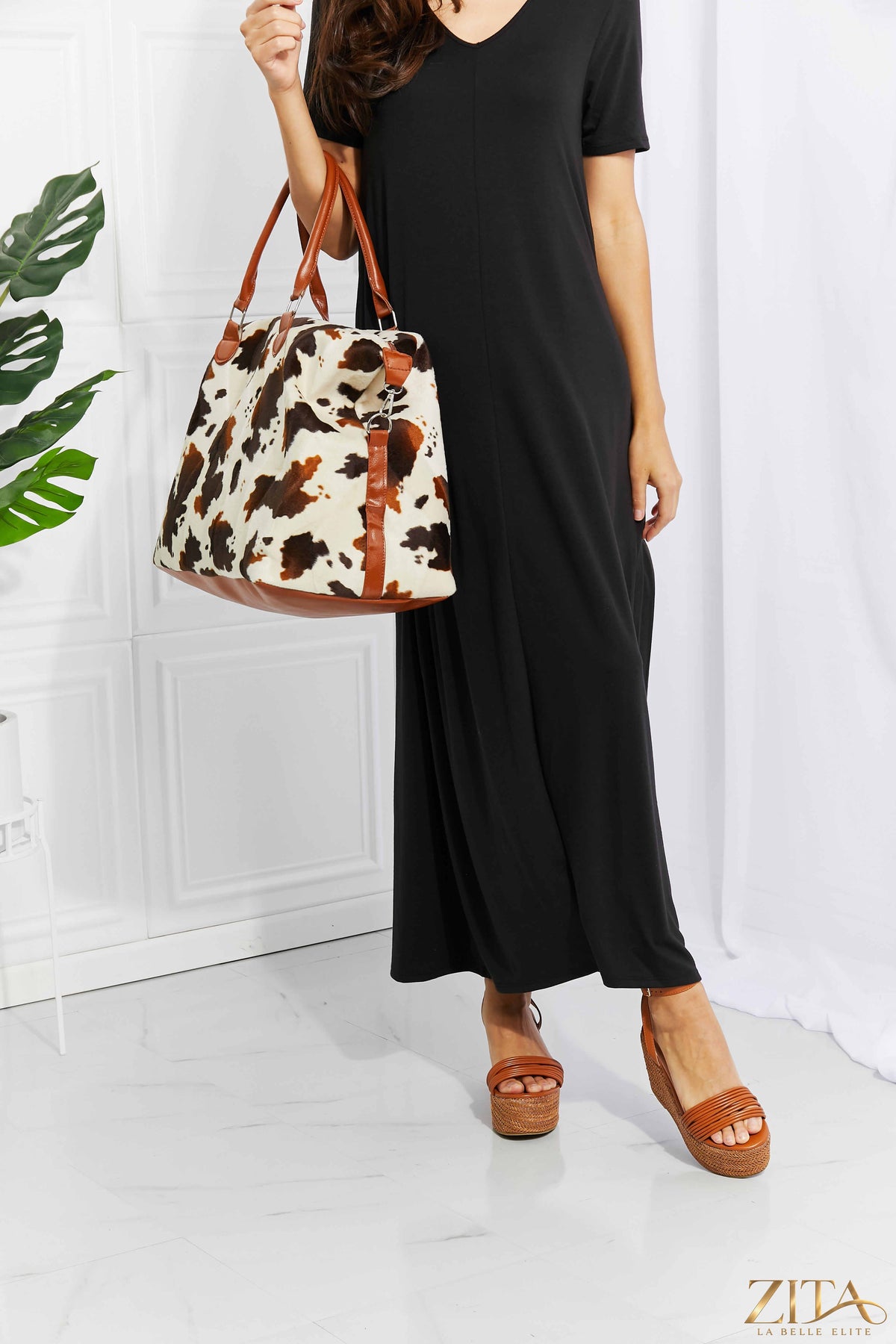 Zita La Belle Elite animal print plush weekender bag with sturdy handles and spacious interior, perfect for travel and weekend trips.