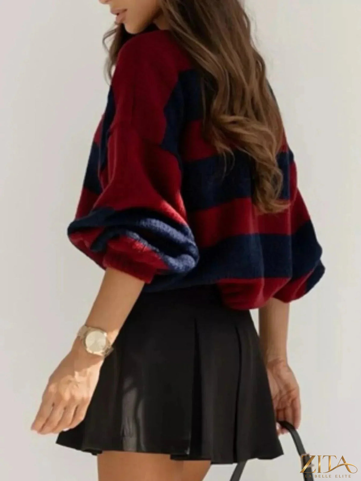 Striped dropped shoulder sweater by Trendsi featuring a relaxed fit, soft knit fabric, and bold horizontal stripes.