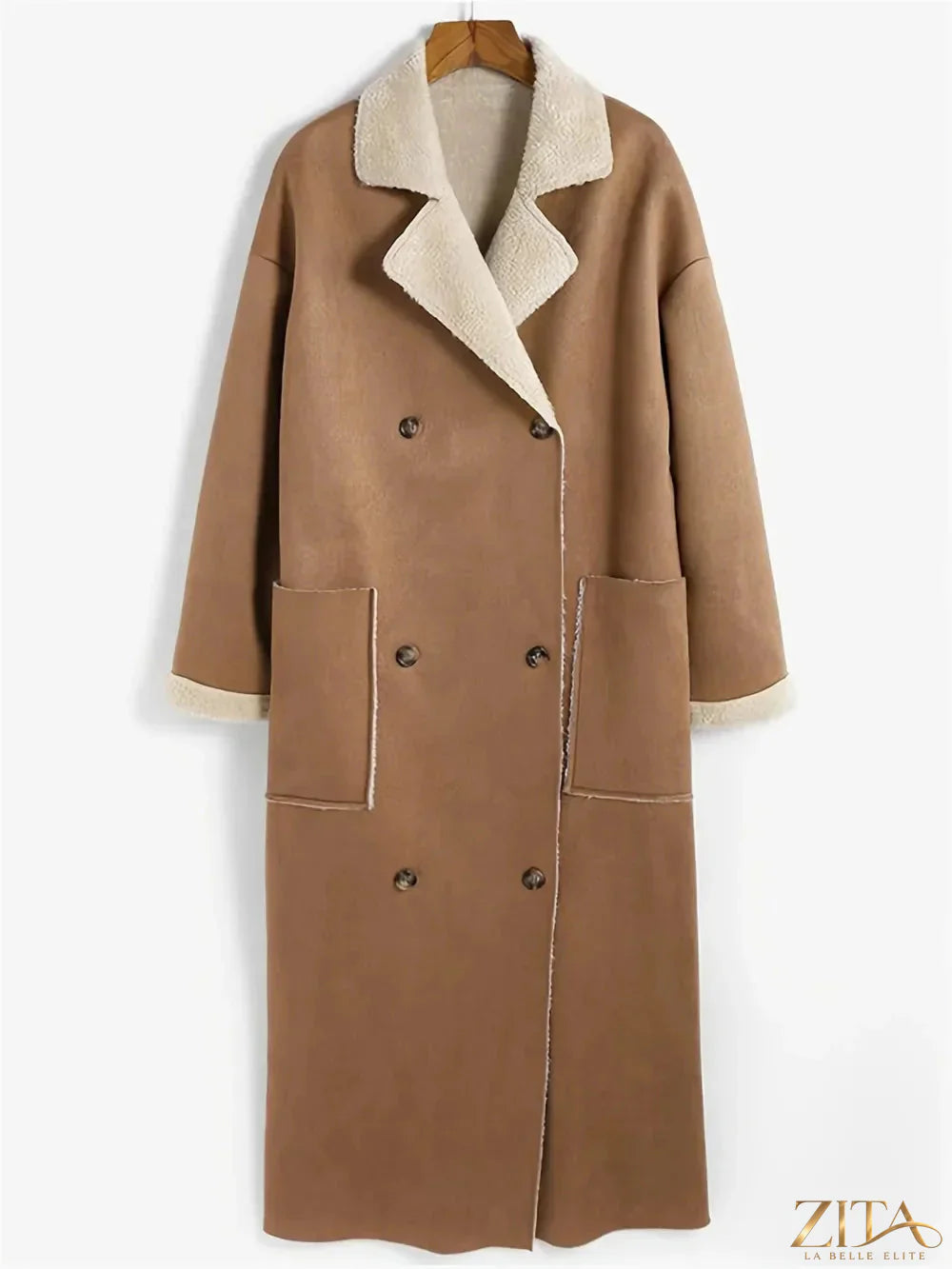 Plus size Zita La Belle Elite drop shoulder sherpa longline coat hanging on a rack with a cozy, plush texture and relaxed fit.