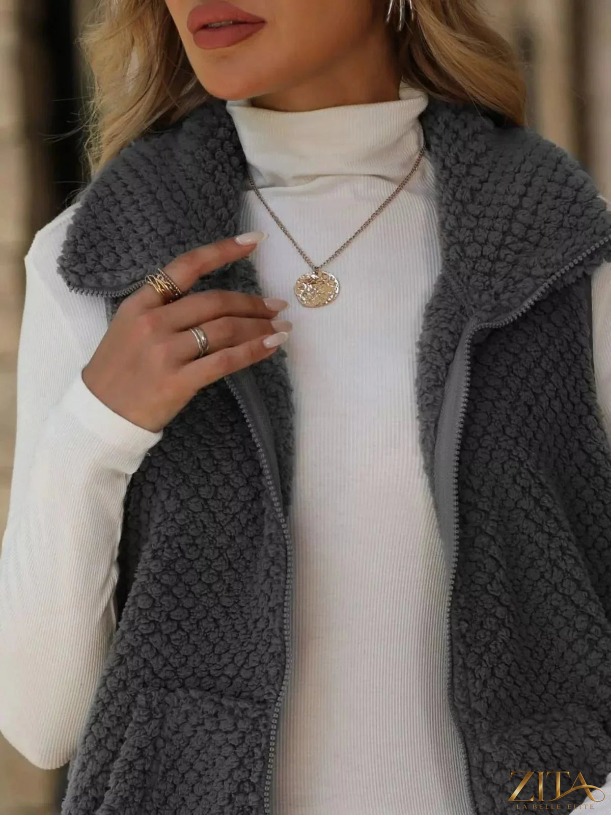 Zita La Belle Elite zip-up vest coat in sleek fabric, front zipper, and stand collar, perfect for layered winter wear.