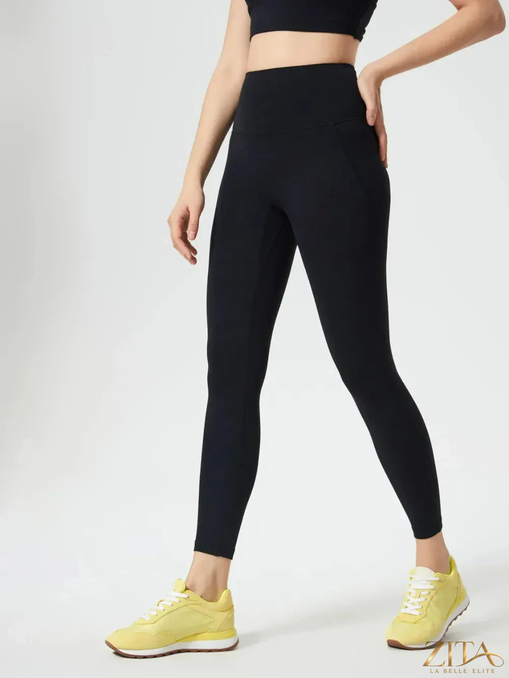 Millennia wide waistband active leggings by Trendsi, black athletic leggings with stretchable waistband, suitable for workouts and active wear.