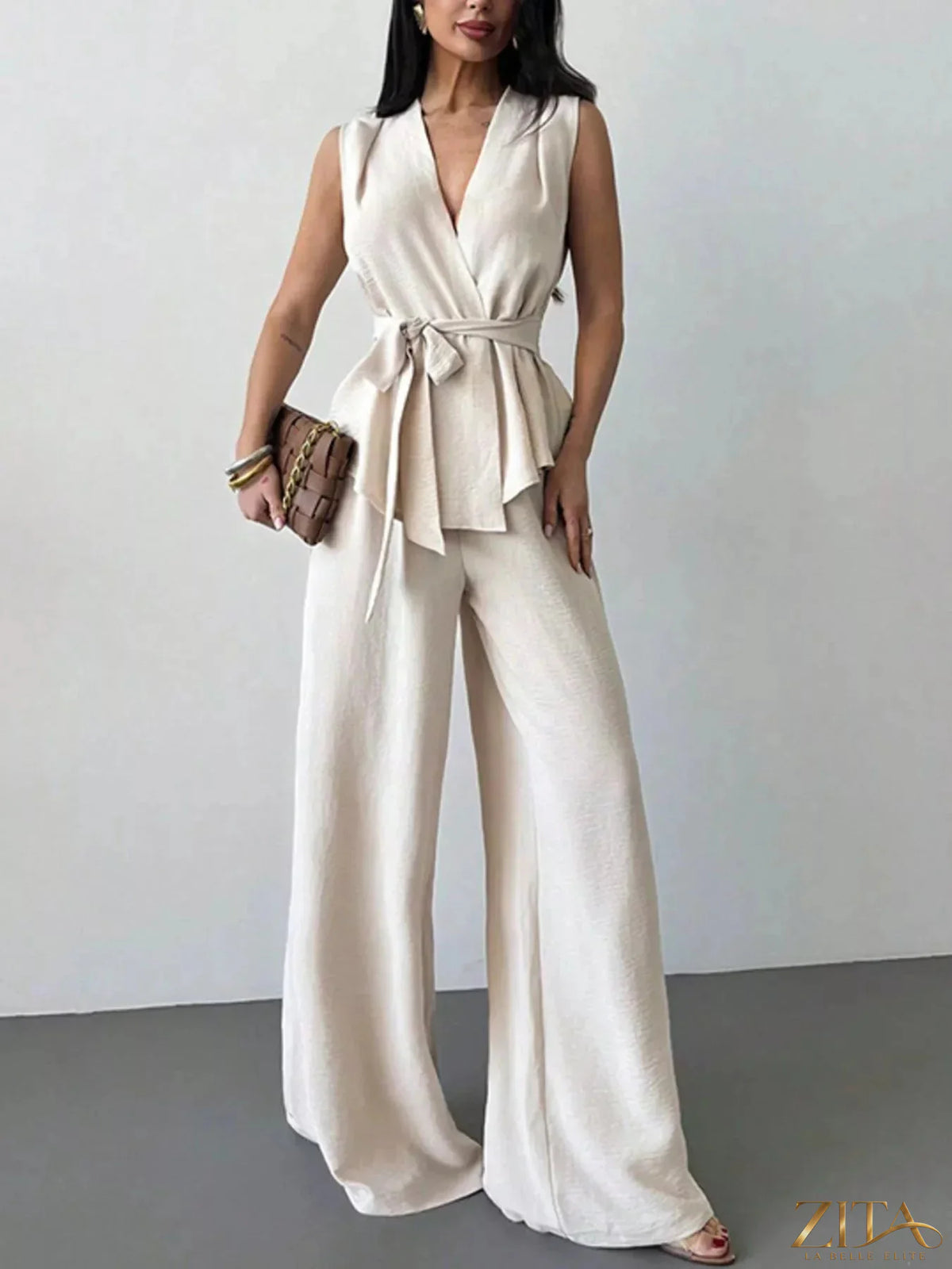 Zita La Belle Elite sleeveless top and wide-leg pants set in neutral fabric, styled together on a hanger.
