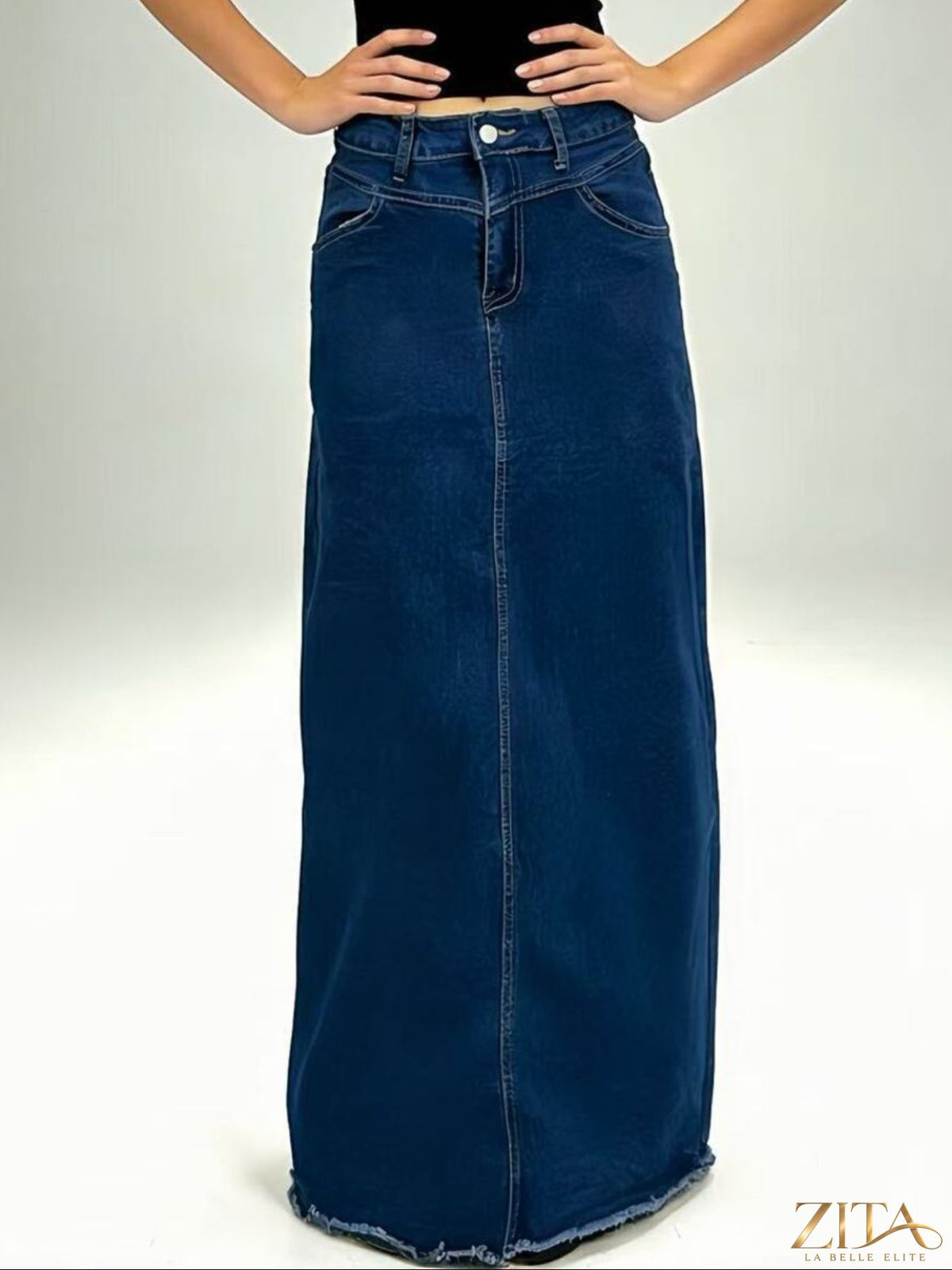 Raw hem maxi denim skirt by Zita La Belle Elite featuring a flowy silhouette and distressed hem detail.