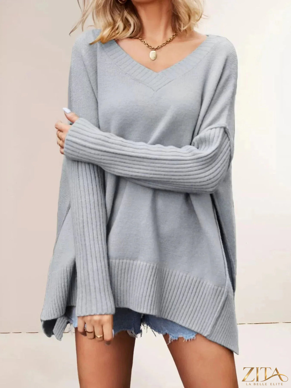 Zita La Belle Elite V-neck ribbed sleeve sweater in soft knit fabric, featuring a fitted V-neck and long ribbed sleeves.