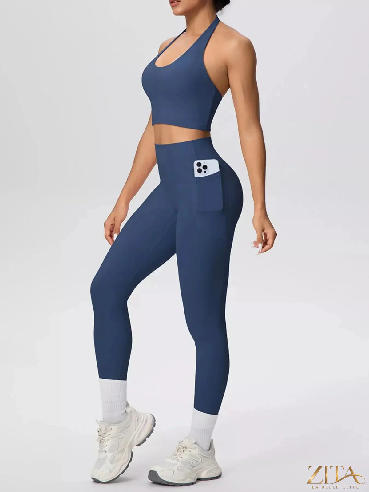 Zita La Belle Elite halter neck crop top and high-waisted leggings active set, in black, on a white background.