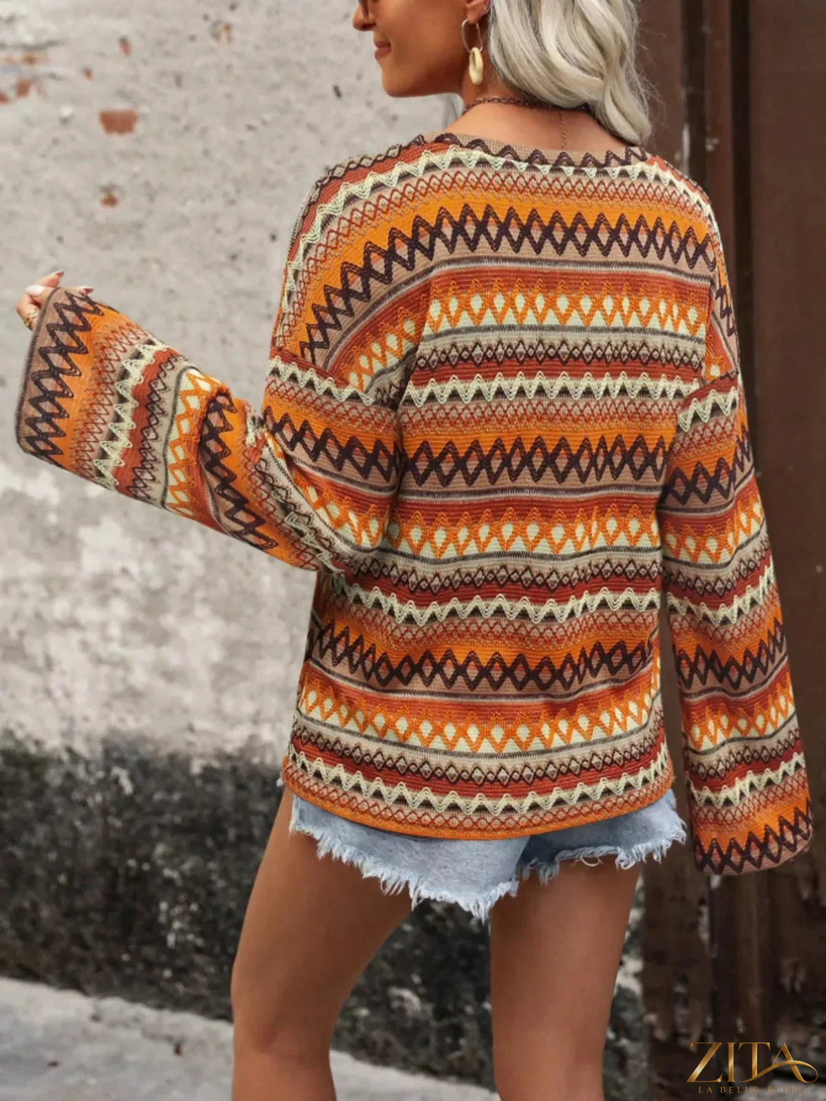 Zita La Belle Elite vibrant multi-color geometric pattern knit top with bold shapes and a fitted style.