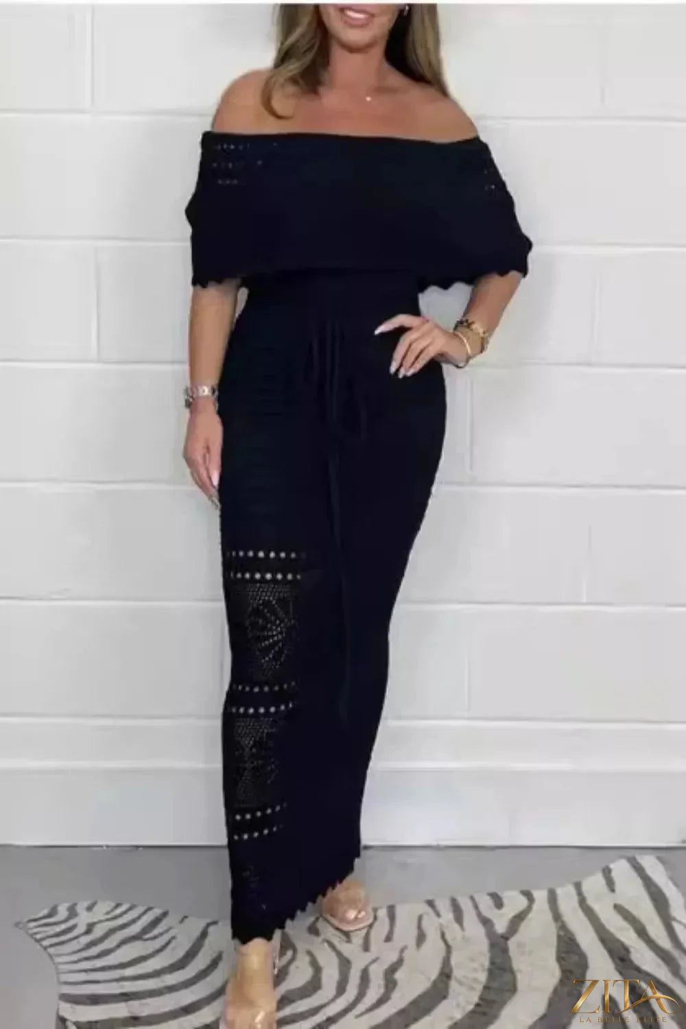 Crochet off-shoulder maxi dress by Zita La Belle Elite featuring intricate crochet details and a flowing silhouette.