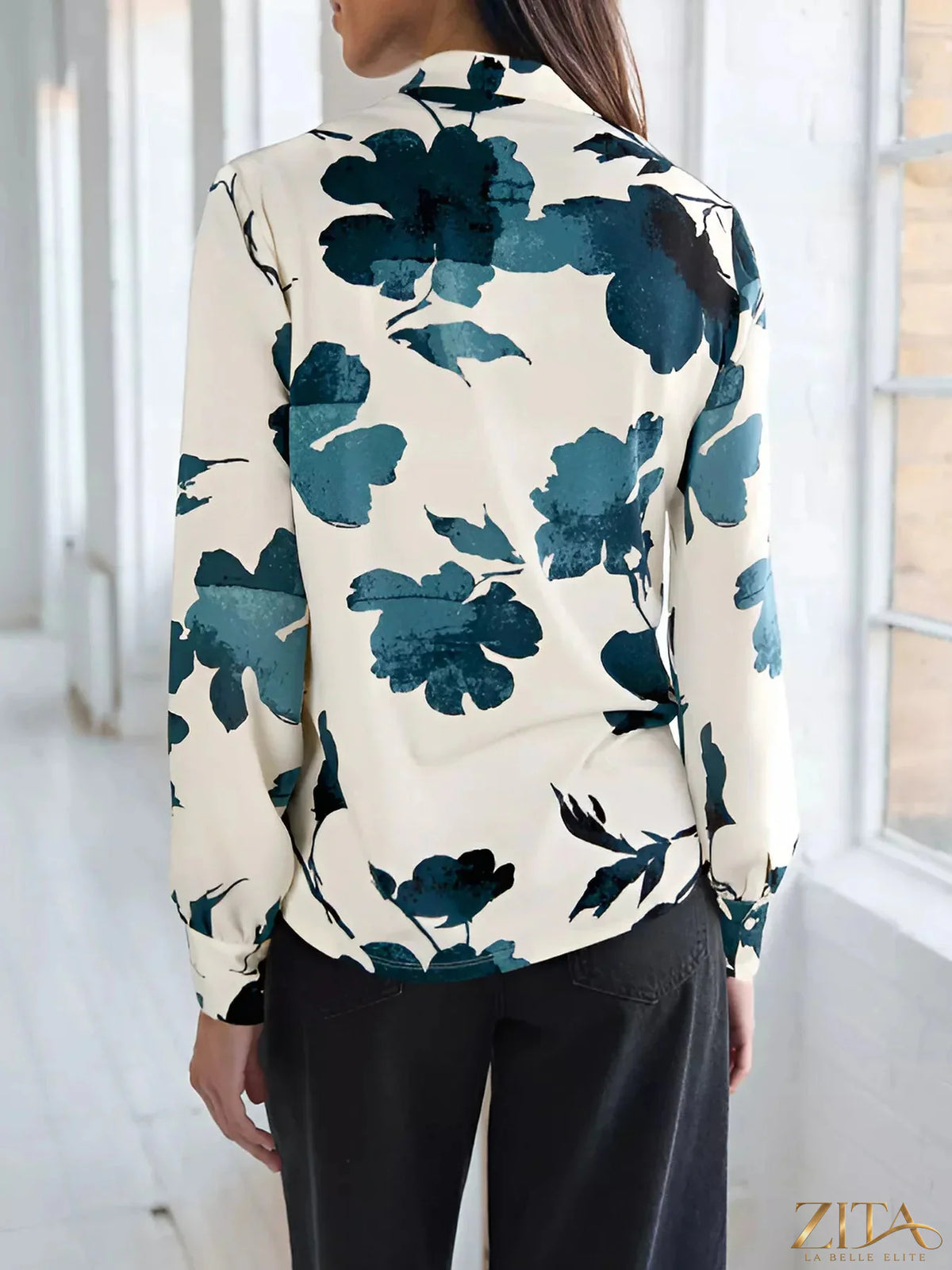 Printed V-neck long sleeve blouse by Zita La Belle Elite, featuring a stylish design and soft fabric, shown on a model.