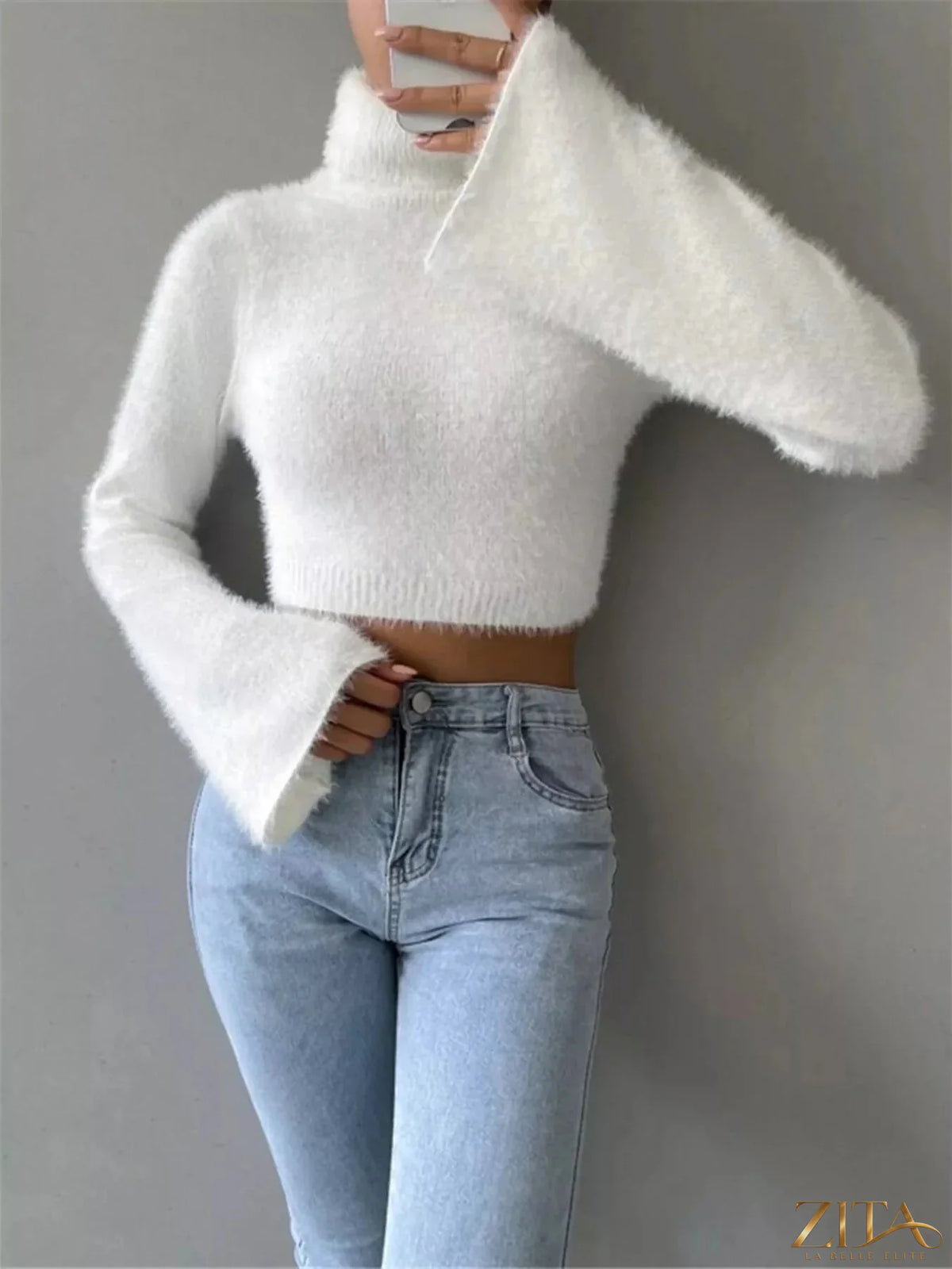 Trendsi turtleneck flare sleeve sweater featuring a fitted bodice and dramatic bell sleeves in soft knit fabric.