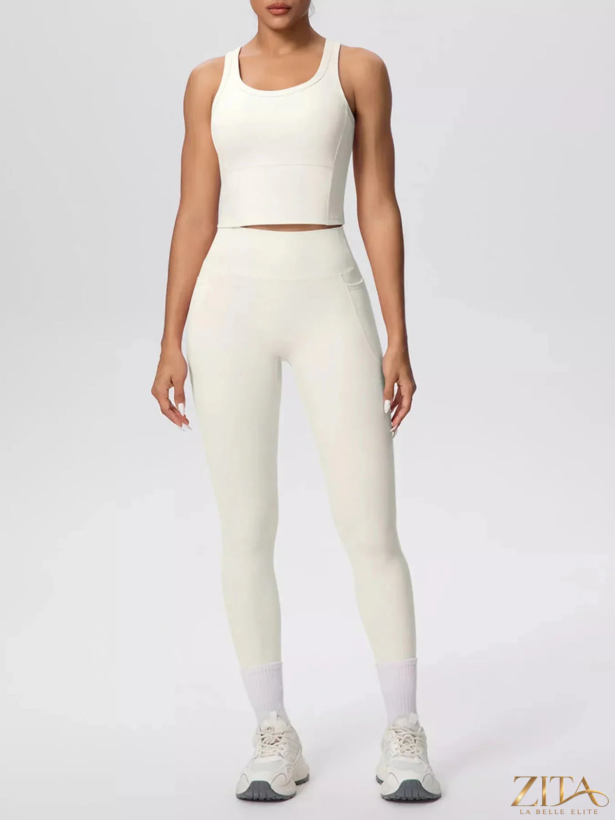 Zita La Belle Elite scoop neck tank top and high-waisted leggings active set, shown on a model, in a sleek athletic style.