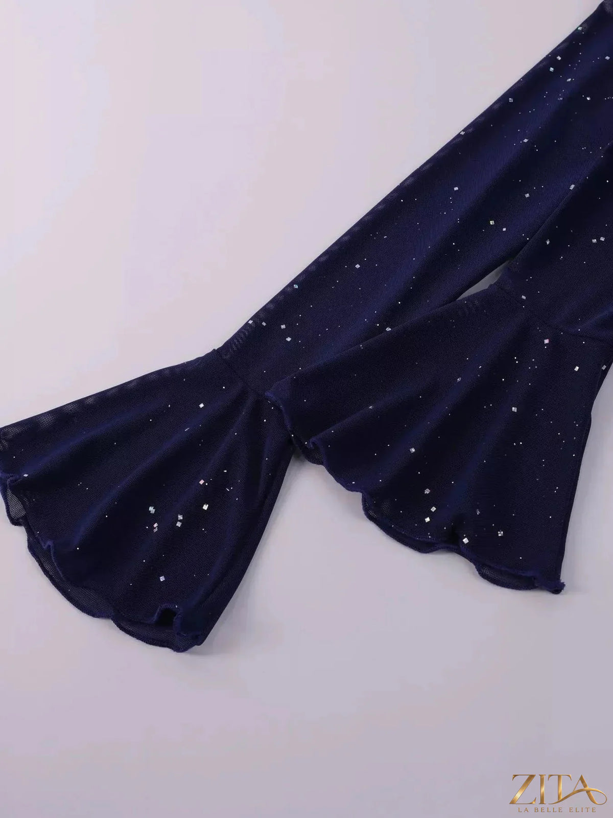 Zita La Belle Elite glitter off-shoulder maxi dress with flowing fabric and elegant design, displayed on a mannequin.