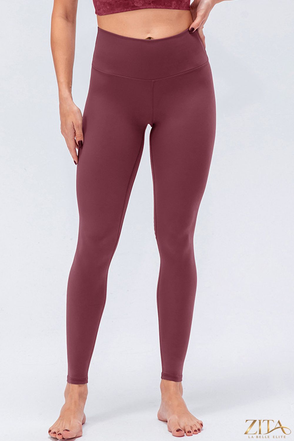 Black wide waistband slim fit active leggings by Trendsi, showing a close-up of the stretchy fabric and comfortable fit.