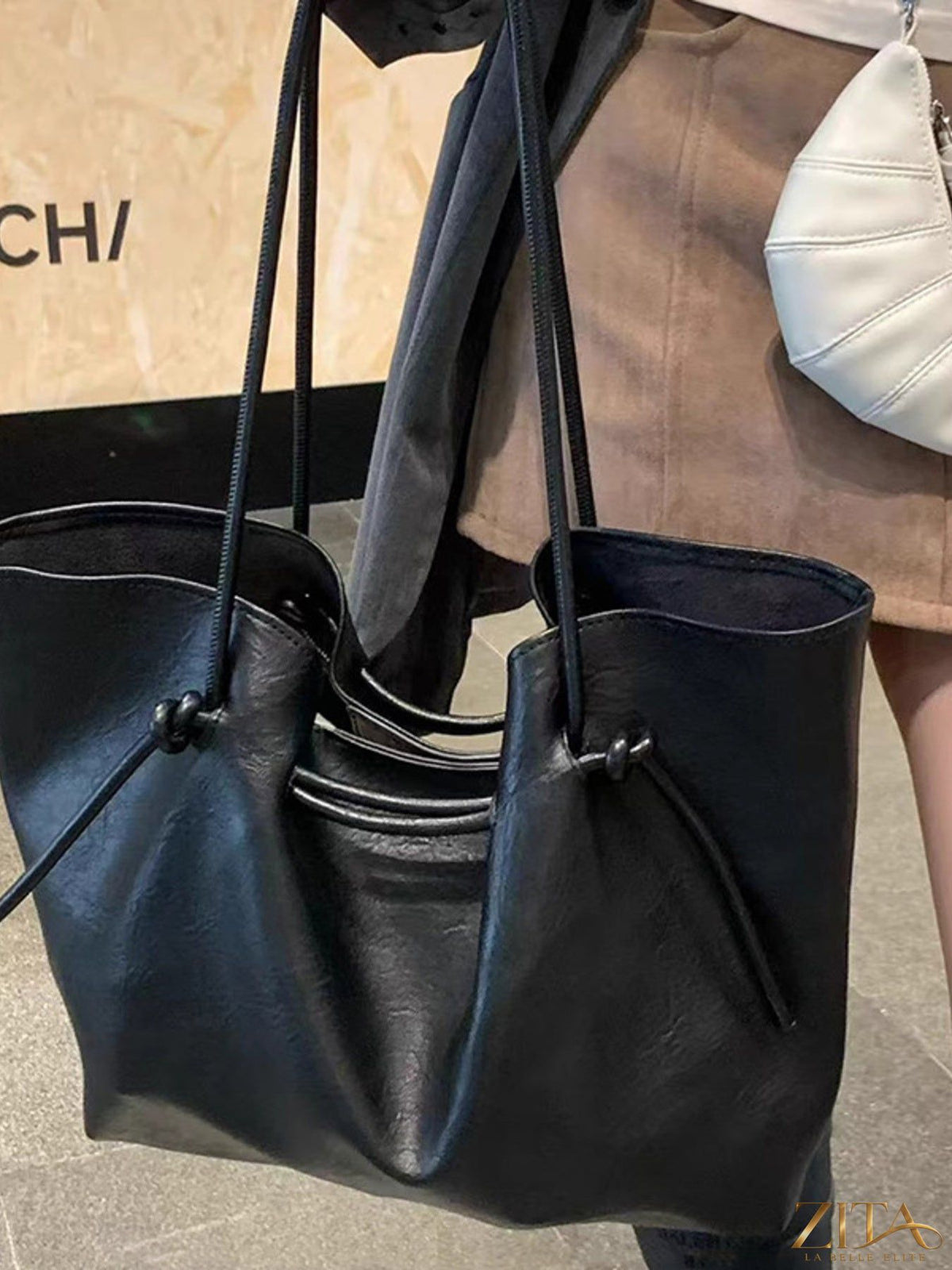 Zita La Belle Elite knot-detail tote bag with woven handles and spacious interior, stylish accessory for everyday use.