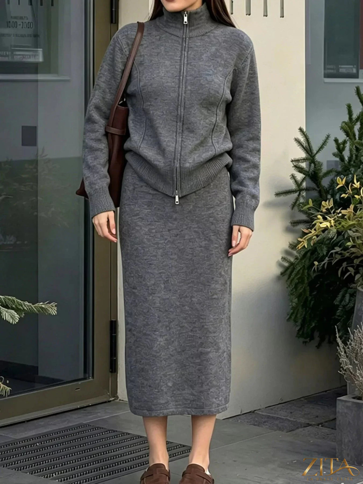 Zita La Belle Elite zip-up mock neck cardigan and matching midi skirt sweater set displayed on a model.