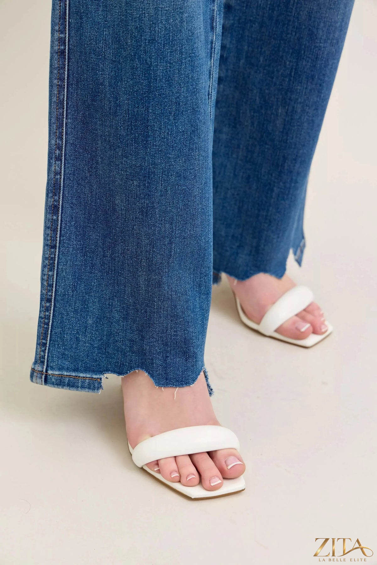Zita La Belle Elite Judy Blue tummy control distressed wide jeans displayed on a model, featuring a fitted waist and faded distressed details.