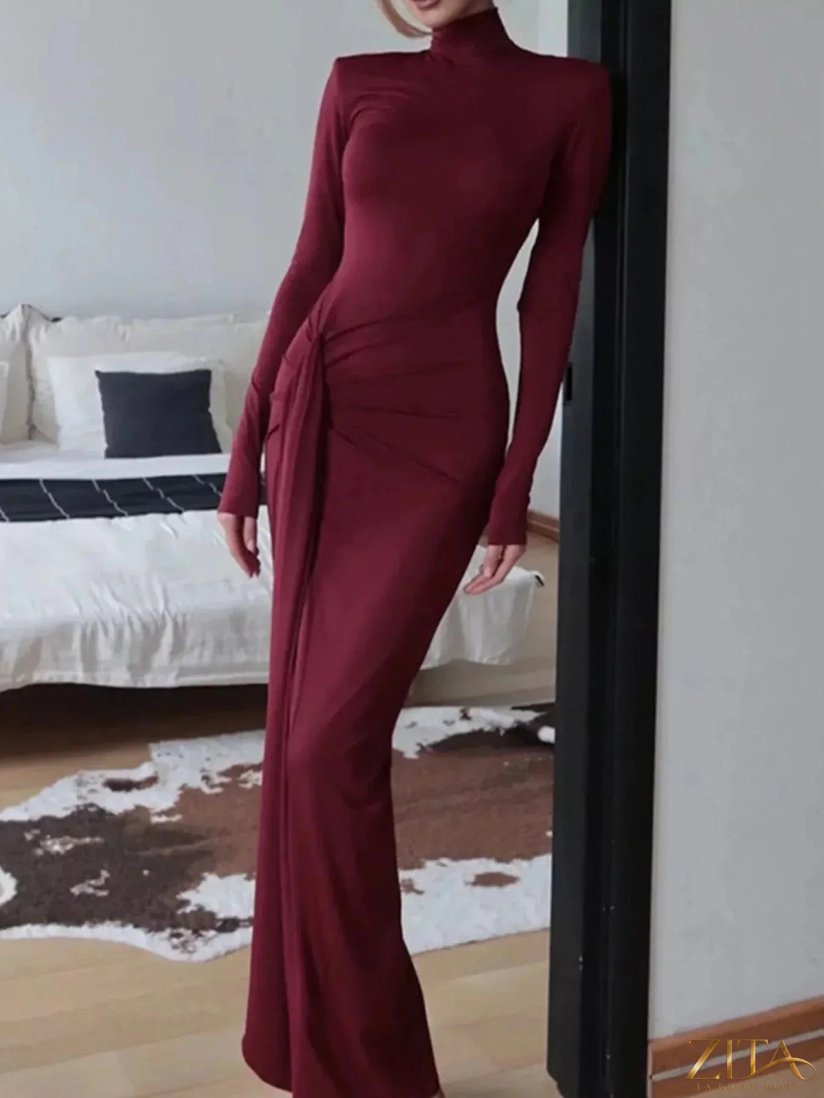 Black turtleneck long sleeve slit maxi dress by Trendsi, shown with flowing fabric and elegant slit detail.