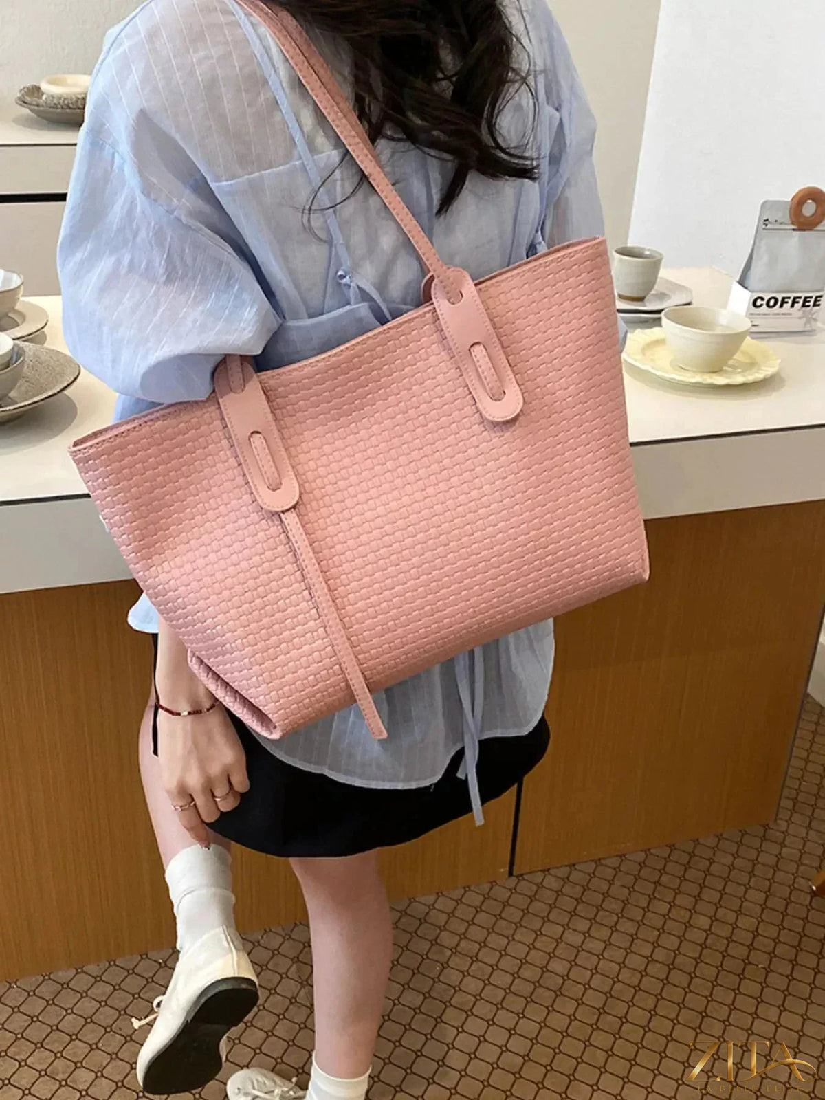 Leather texture tote bag by Zita La Belle Elite with sturdy handles and spacious interior, showcasing elegant craftsmanship and design.