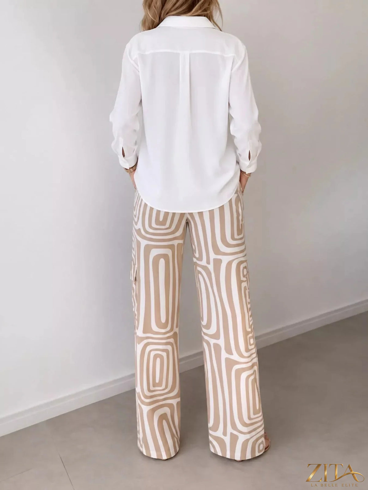 Plus size Zita La Belle Elite button-down shirt with geometric wide-leg pants set, featuring a stylish, coordinated outfit.