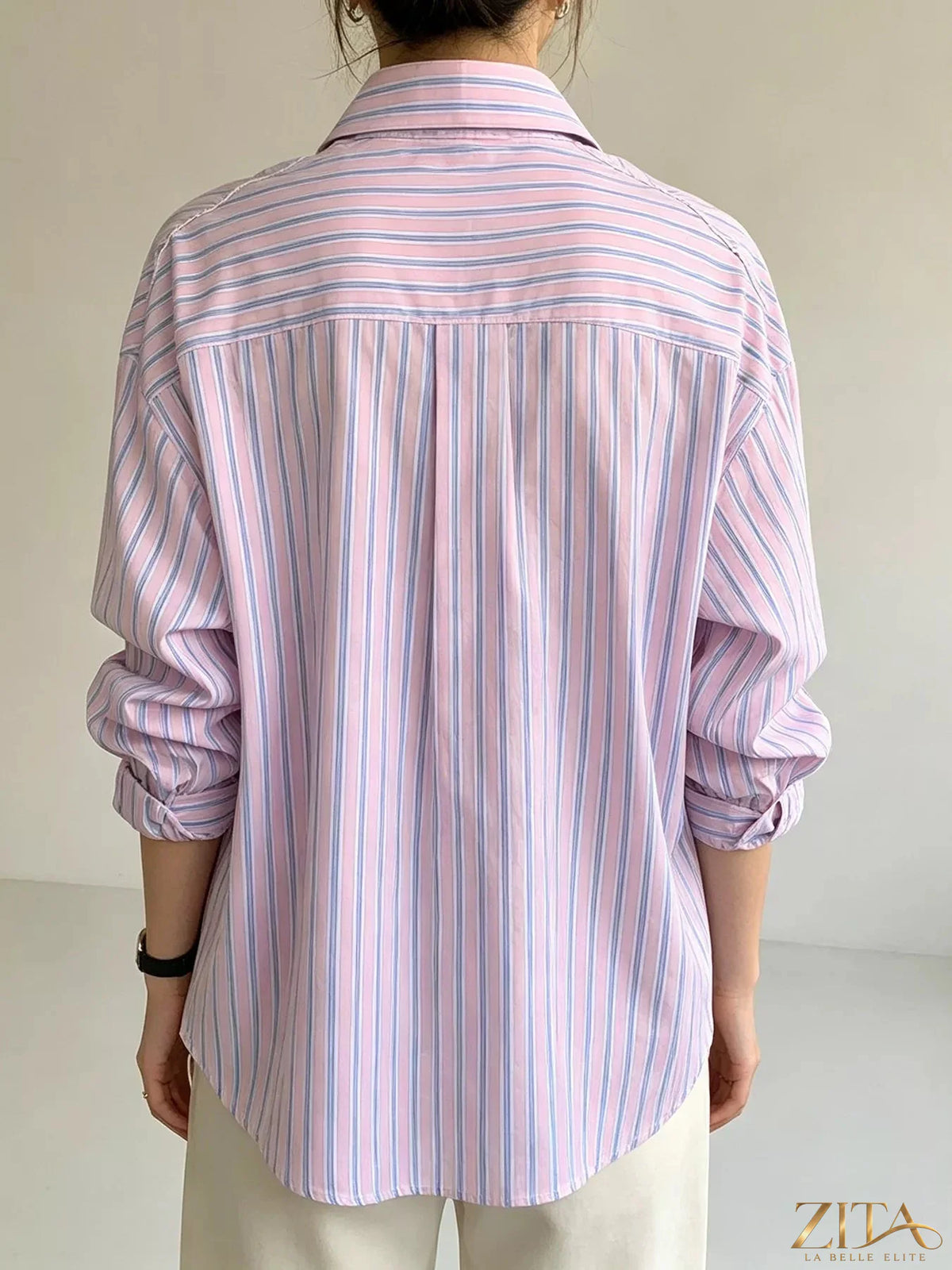 Zita La Belle Elite striped button-down shirt with blue and white vertical stripes, classic collar, and long sleeves.