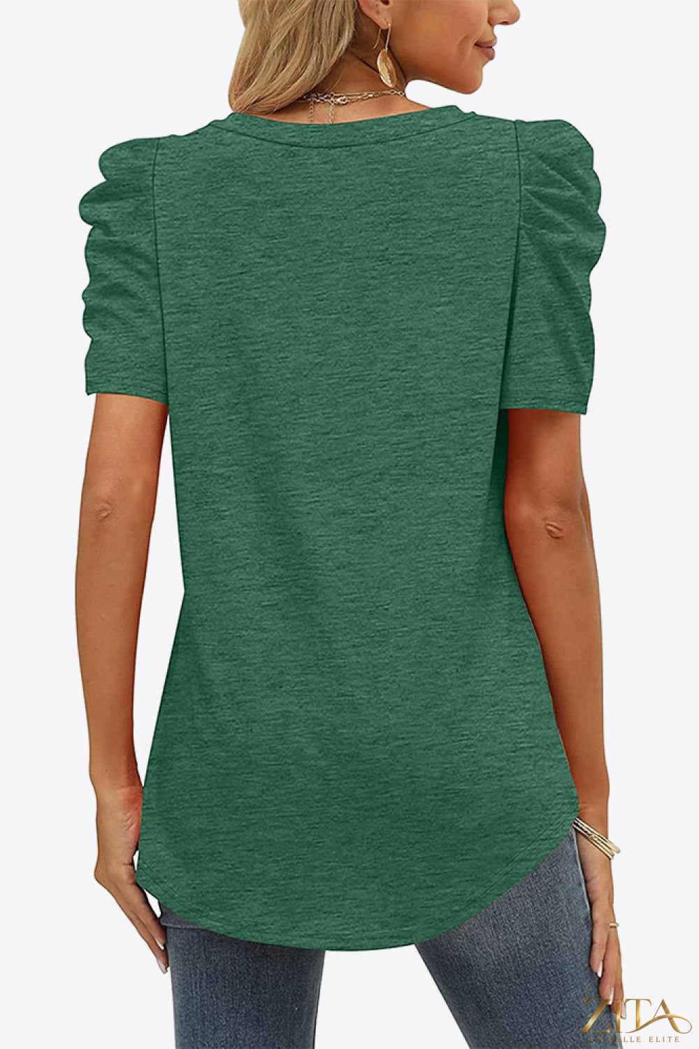 V-neck puff sleeve tee by Trendsi featuring a fitted silhouette, soft fabric, and fashionable puffed sleeves on a model.