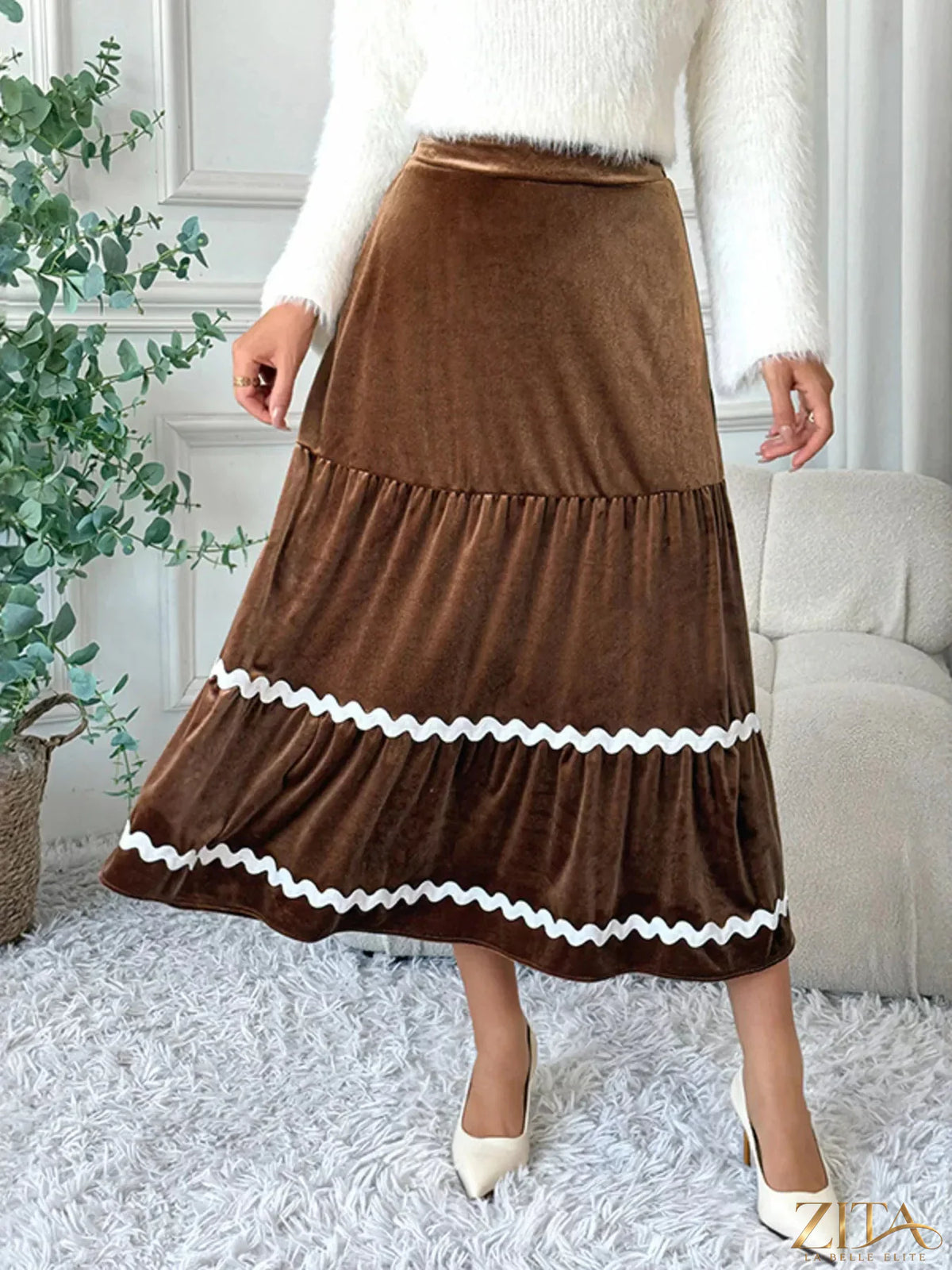 Velvet tiered midi skirt from Trendsi featuring a flowing design and rich fabric in a stylish, layered silhouette.