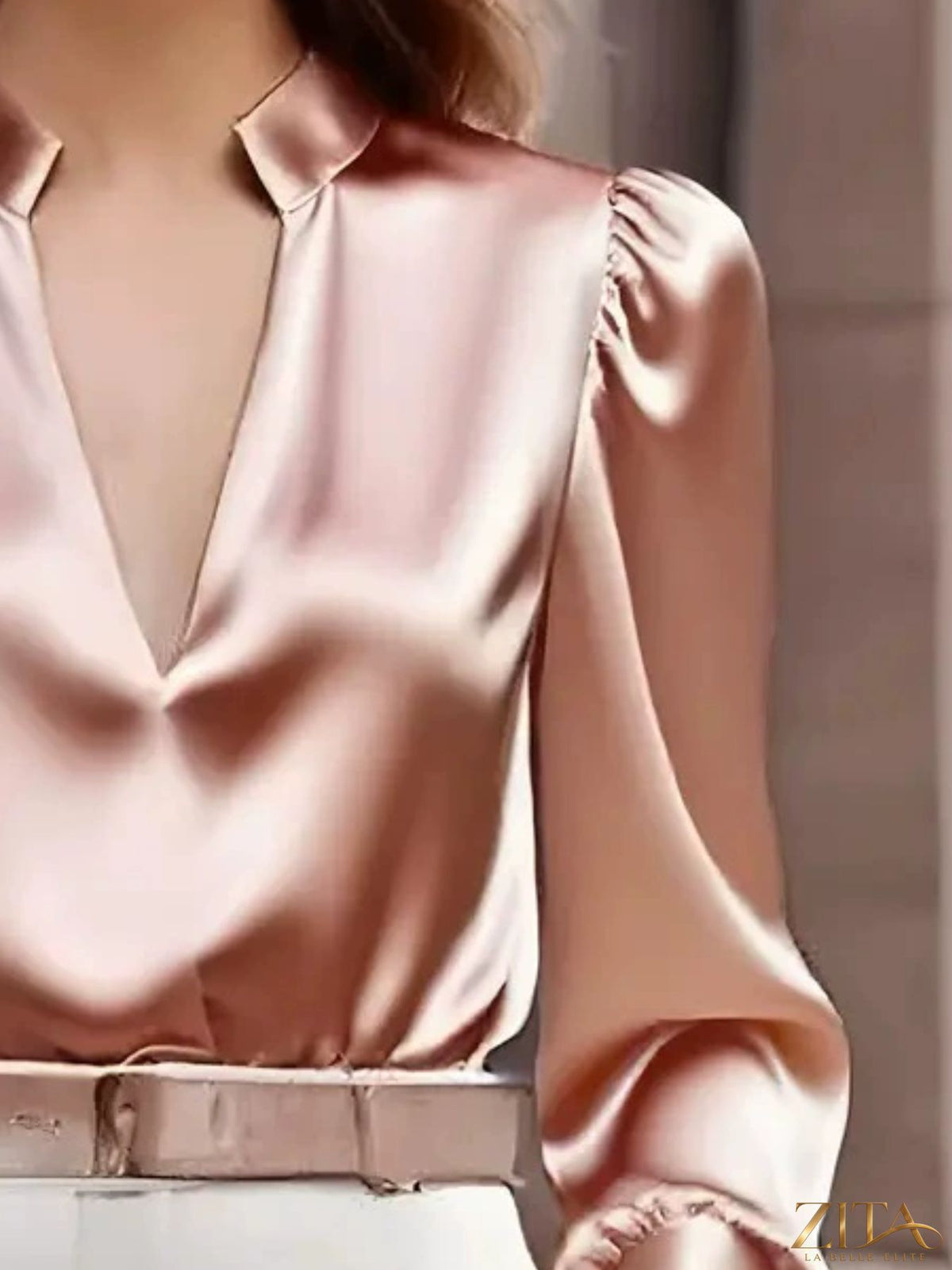 Zita La Belle Elite notched long sleeve blouse with collar and button details, shown in a close-up image.