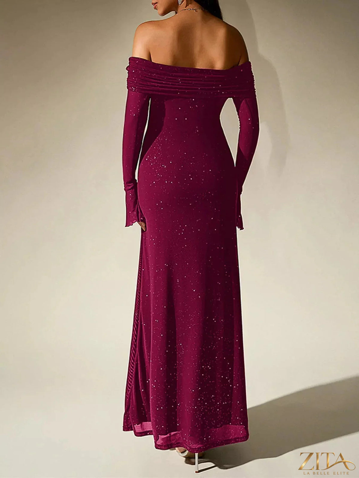 Shimmering off-shoulder maxi dress by Zita La Belle Elite featuring glitter fabric and elegant flowy design.