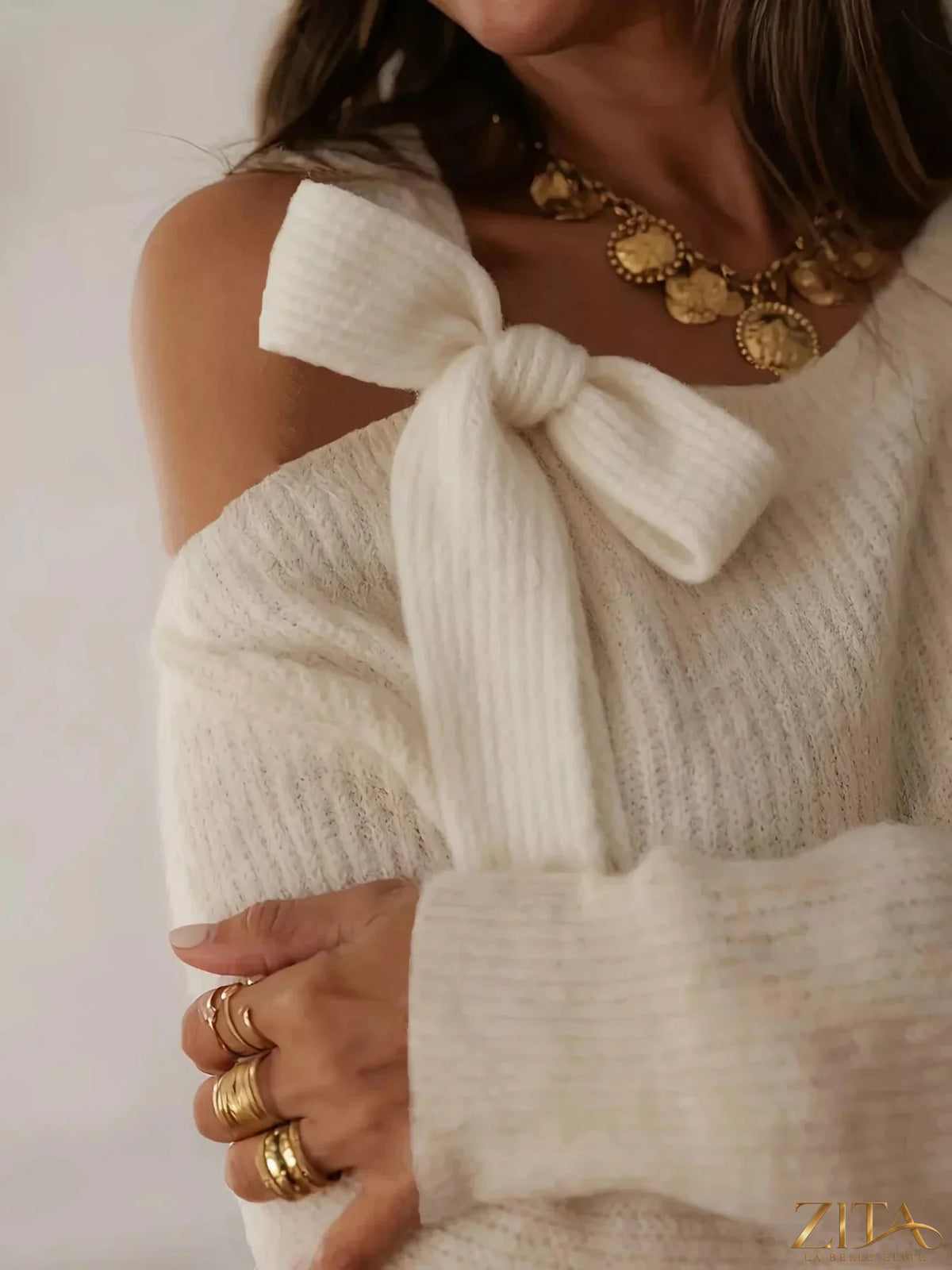 Zita La Belle Elite bow-accent one-shoulder sweater in soft knit fabric, featuring a stylish bow detail on the shoulder.