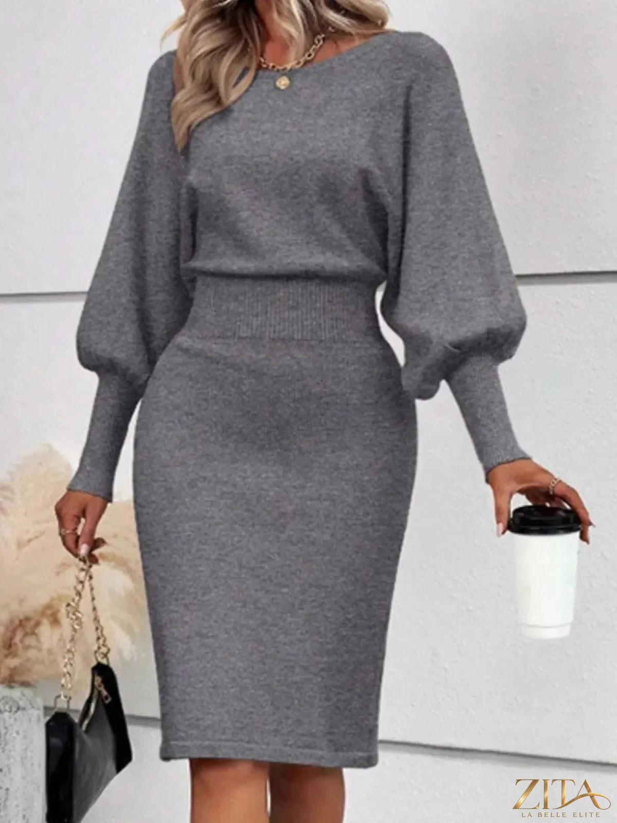 Zita La Belle Elite lantern sleeve bodycon sweater dress in black, close-up showing fitted silhouette and stylish sleeve design.