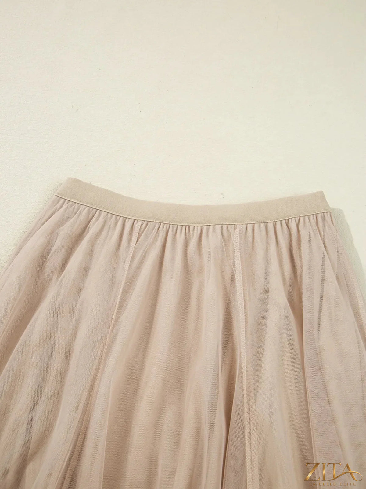 High-waisted midi skirt from Trendsi featuring a flowing design and a flattering fit, perfect for casual or dressy outfits.