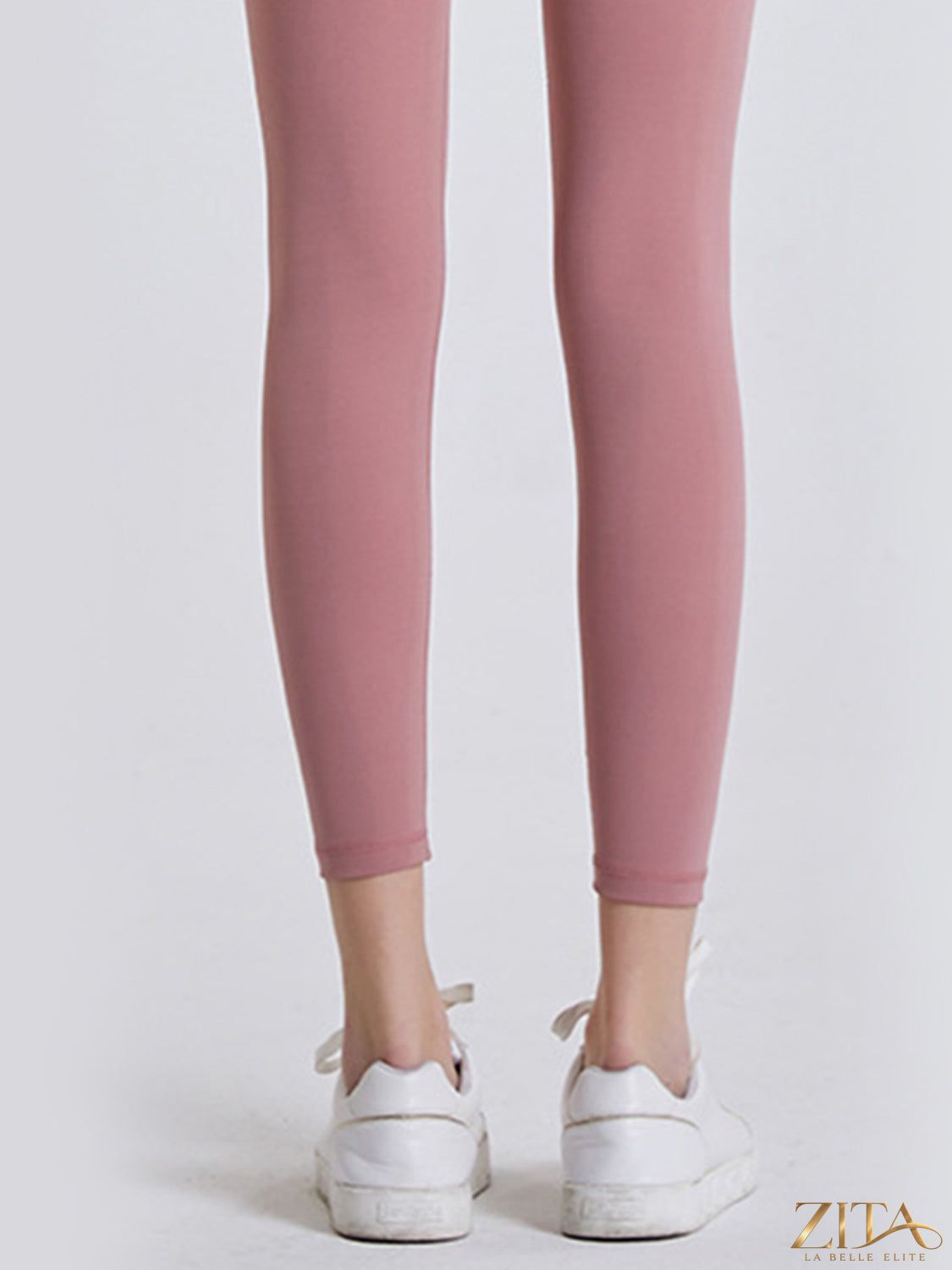 Zita La Belle Elite wide waistband sports leggings in black, stretchy fabric, shown on a model for active wear or workout.