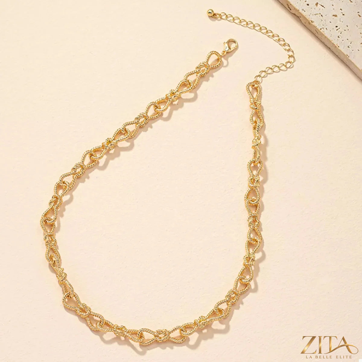 18K gold-plated chain link necklace by Zita La Belle Elite, showing close-up of shiny, interconnected chain links.