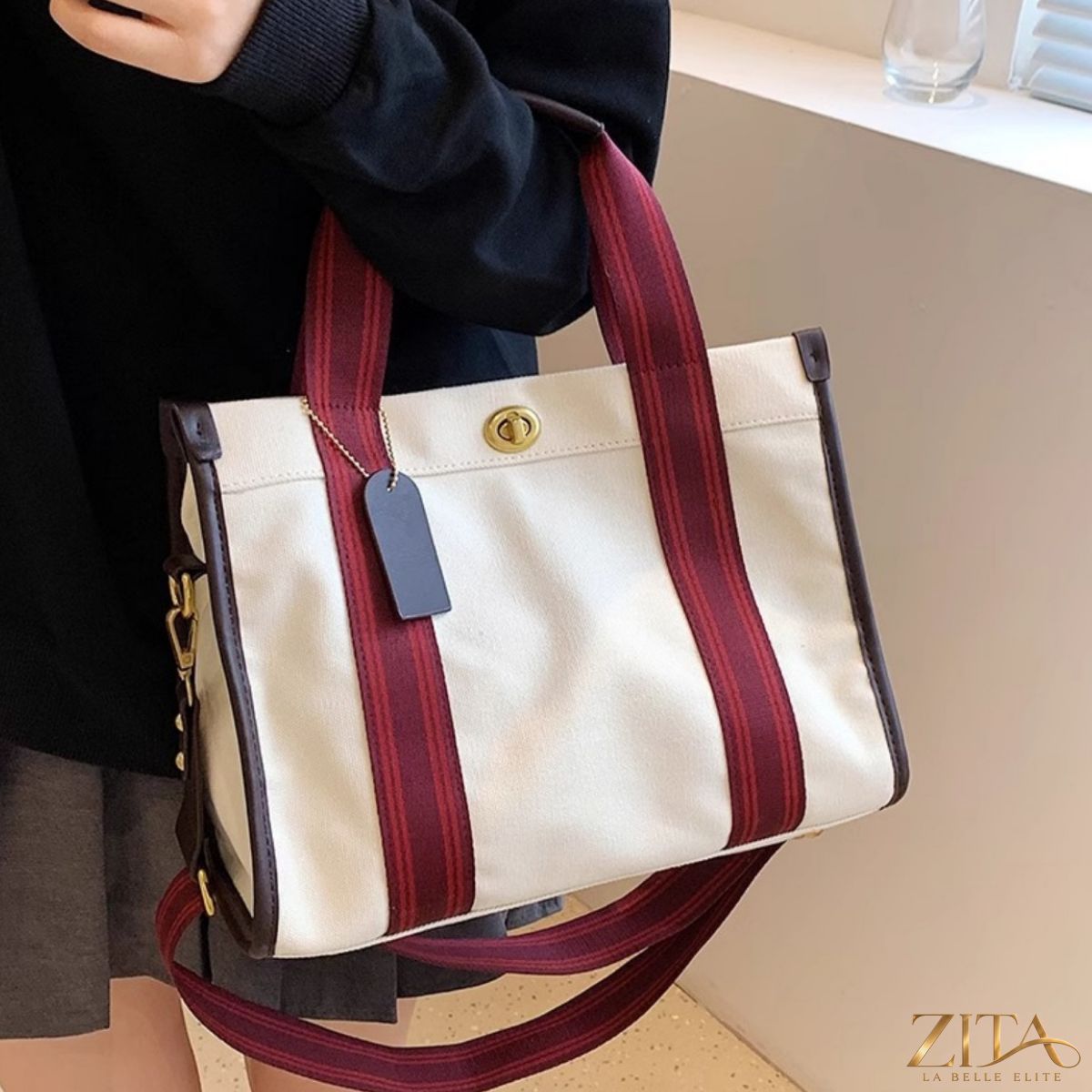 Contrast canvas tote bag by Zita La Belle Elite with black and white design, featuring sturdy handles and spacious interior.