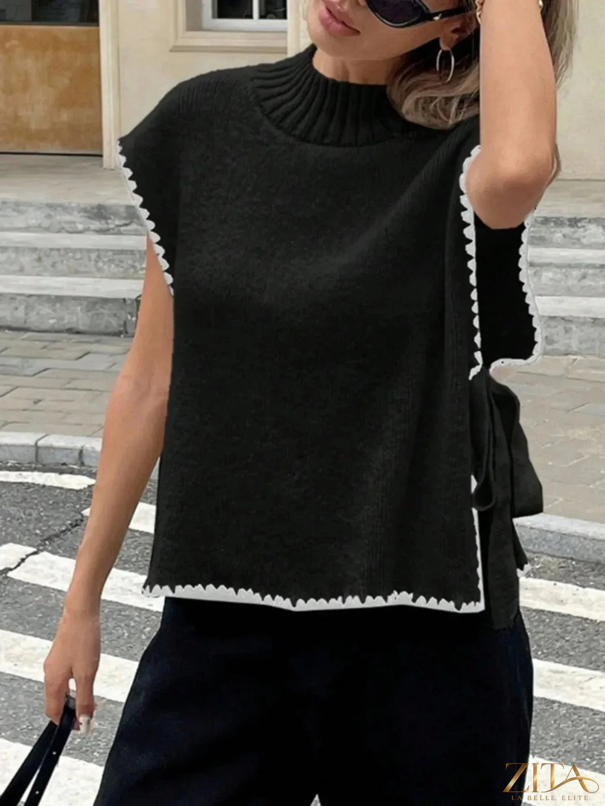 Ribbed turtleneck sweater vest with contrast trim, Trendsi brand, featuring a fitted design and ribbed texture.
