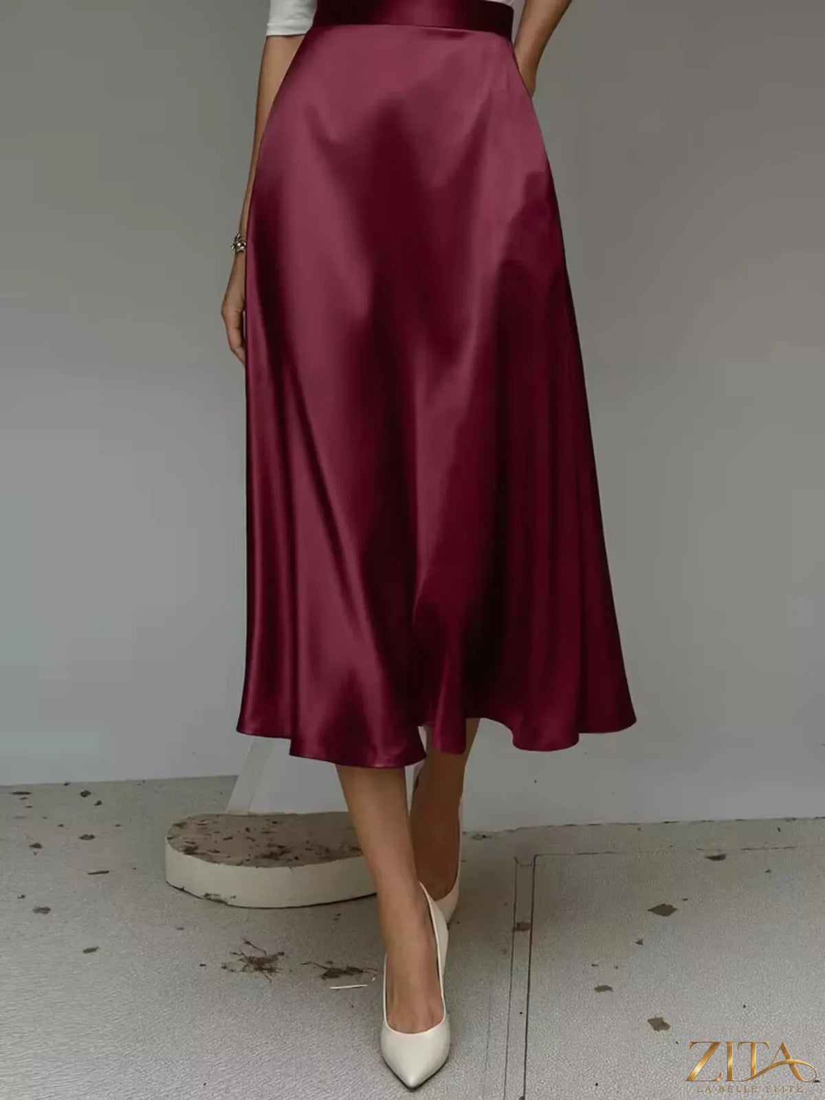 Zita La Belle Elite satin midi skirt in soft, flowing fabric with a high waist and elegant design.