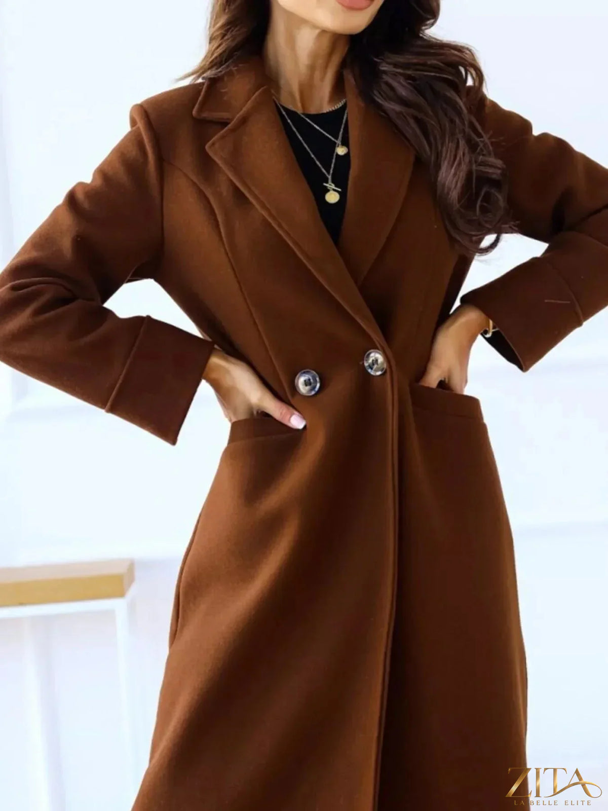Zita La Belle Elite wool blend overcoat with a classic lapel collar, tailored fit, and stylish design in neutral tones.