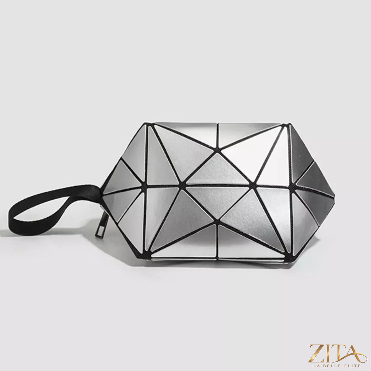 Geometric leather wristlet in neutral tones with sleek design, featuring a wrist strap and minimalist style from Trendsi.