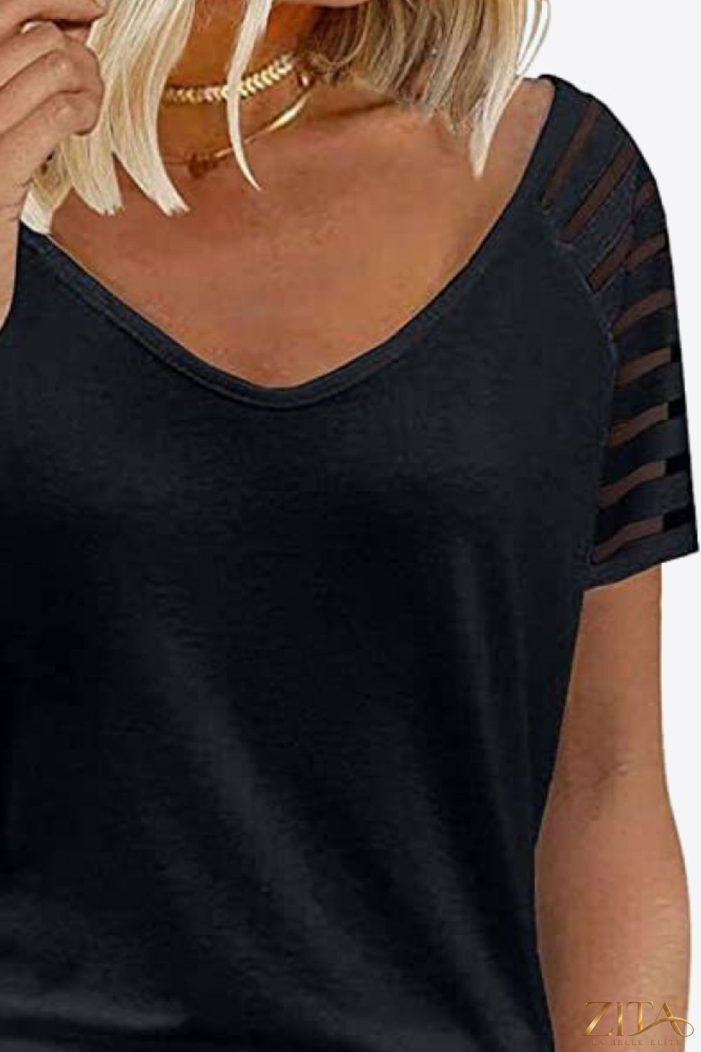 V-neck raglan sleeve tee in soft fabric by Trendsi, featuring contrasting colored sleeves and a casual, comfortable fit.